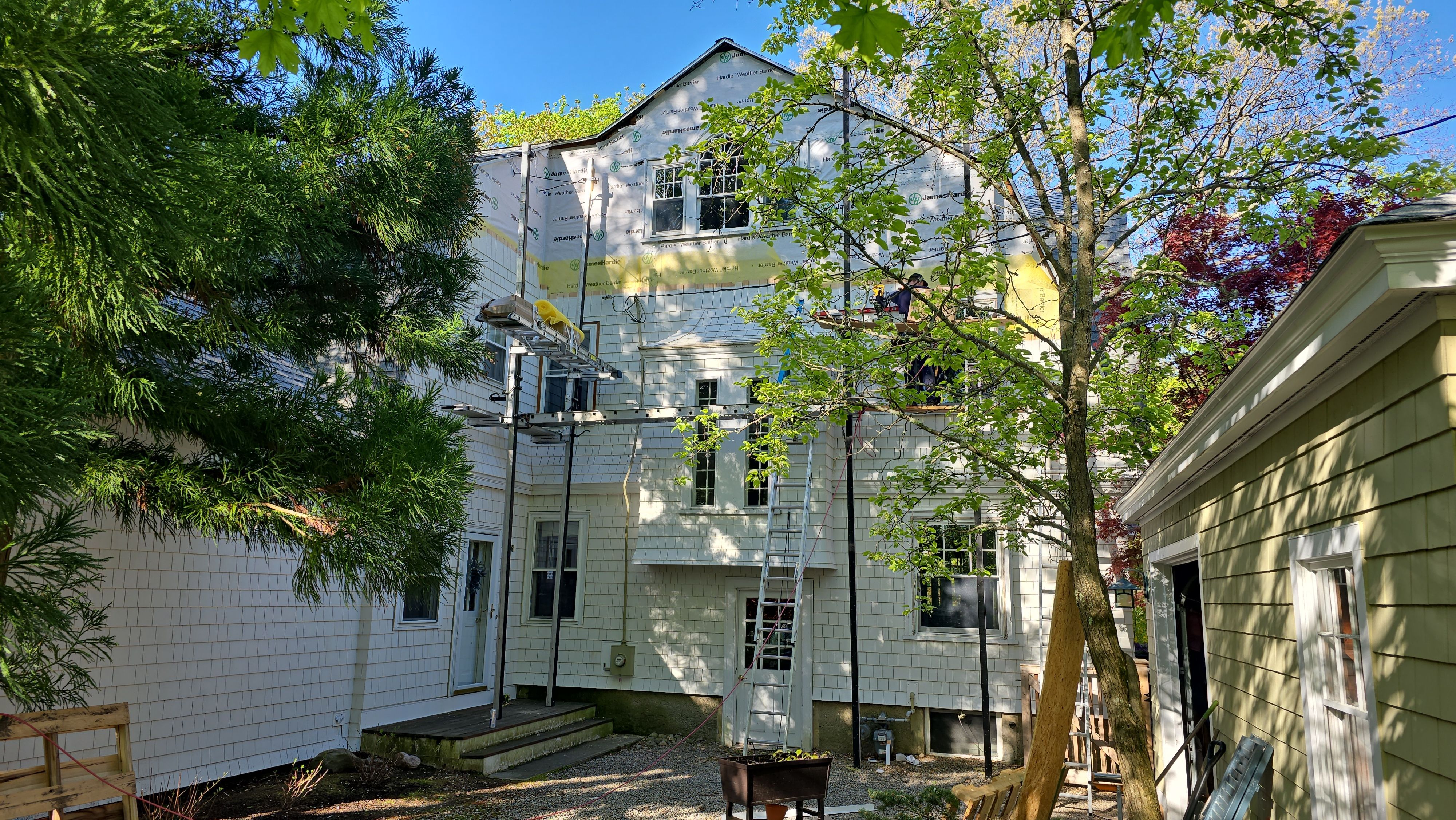 White cedar shingles and windows in Wayland, MA by UBrothers Construction