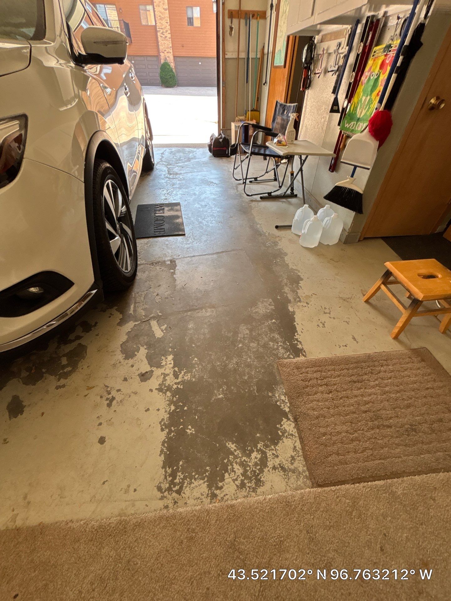 Domino Flake Garage Floor Coating Installation in Sioux Falls by Select Painting, Coatings & Garage Cabinets