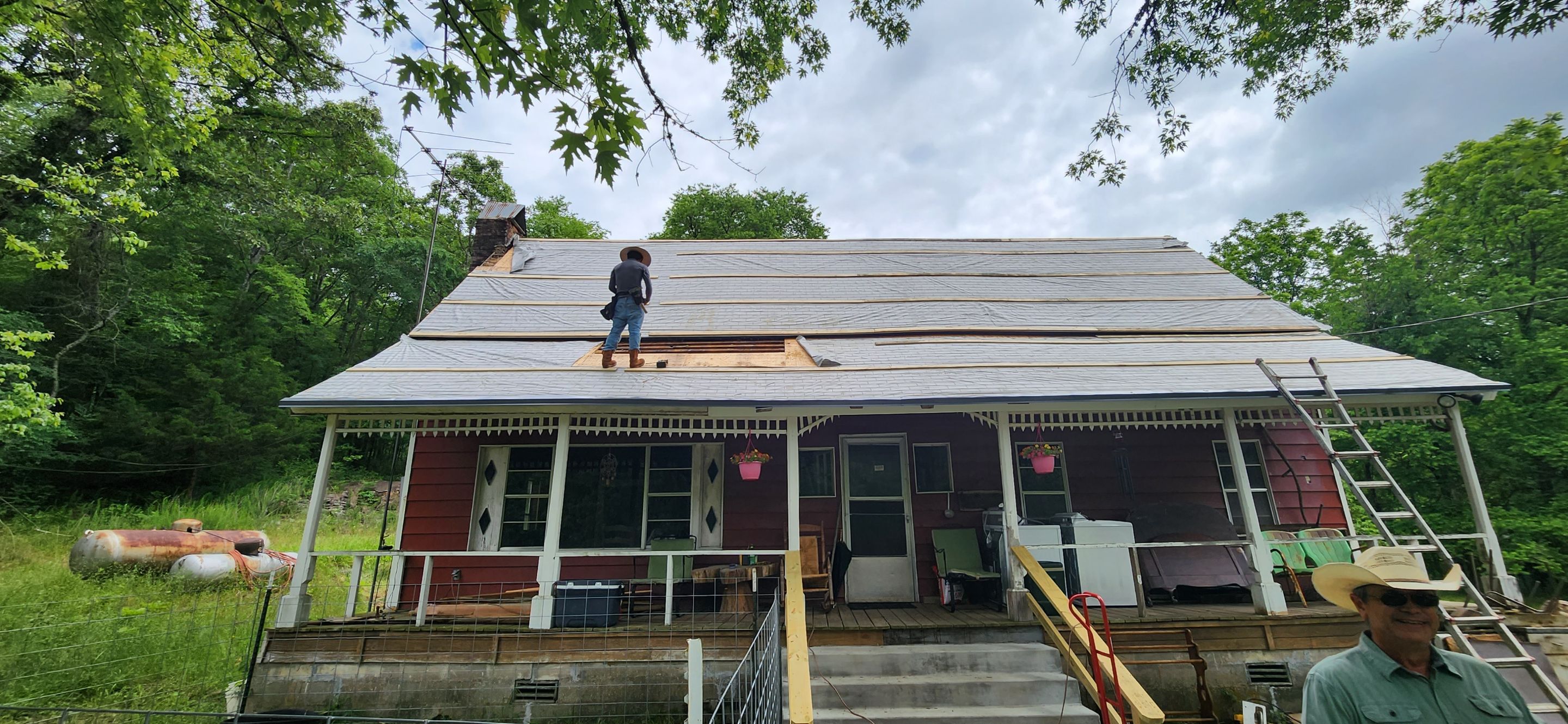 Residential Roofing Installation using 26 Gauge Colored Panels by Hostetler Roofing