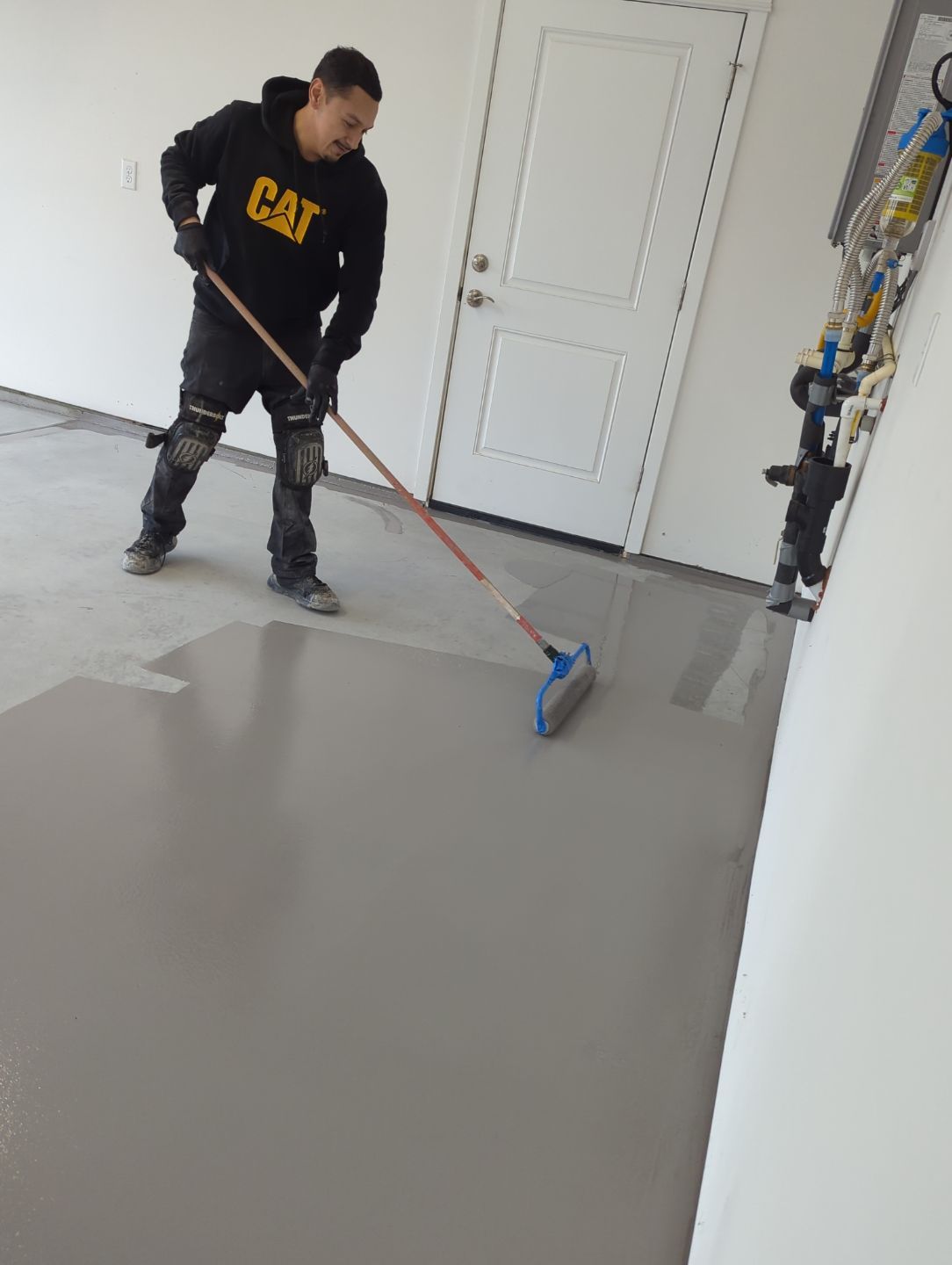 Garage Transformation using Domino with Blue by Croc Coatings, LLC