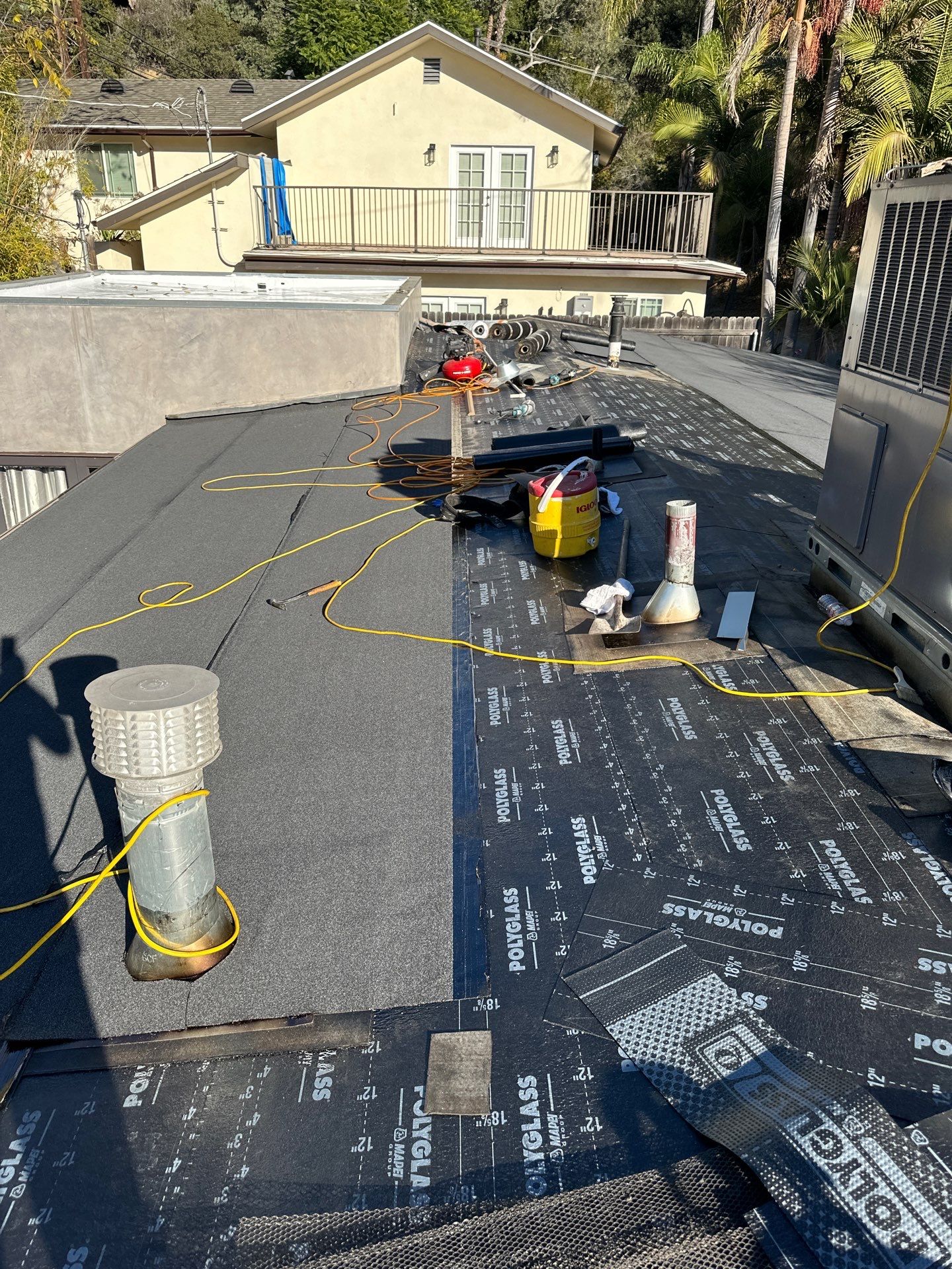 Residential Roofing Installation using Polyfresko® G Highly Reflective Modified Bitumen Cap Sheet by Hull Brothers Roofing