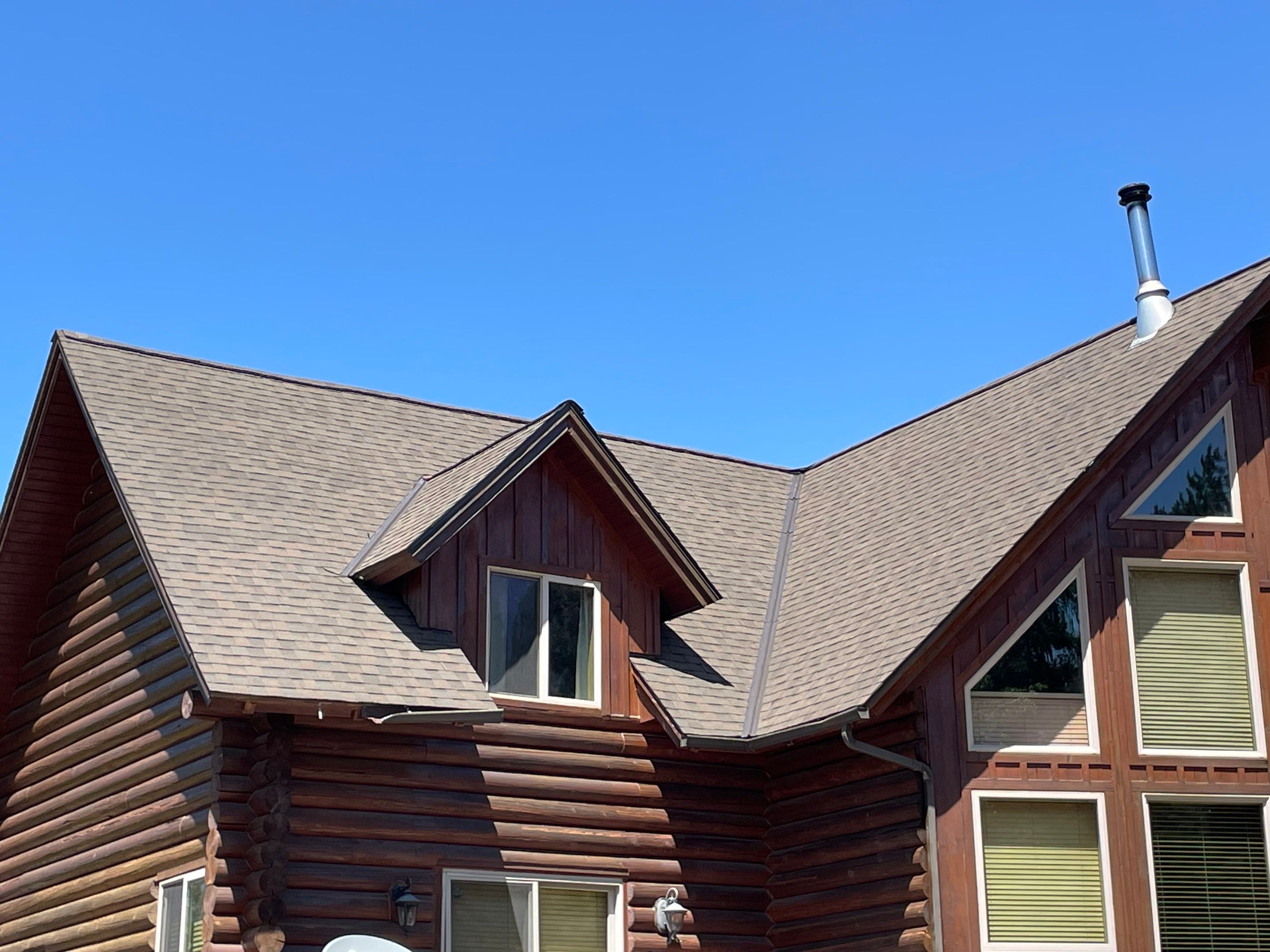 Architectural Shingle Roof Installation for Spirit Lake Log Home Coeur D'Alene Drive Spirit Lake, Idaho, 83869 (SECTION A) PARTIAL ROOF REPLACEMENT - CertainTeed 50 Year Material Guarantee - CertainTeed Workmanship Guarantee: 30 Years - CertainTeed Warranty Transfer Period: 20 Years - Certainteed Landmark® Shingle - Heather Blend by Alpine Roofing