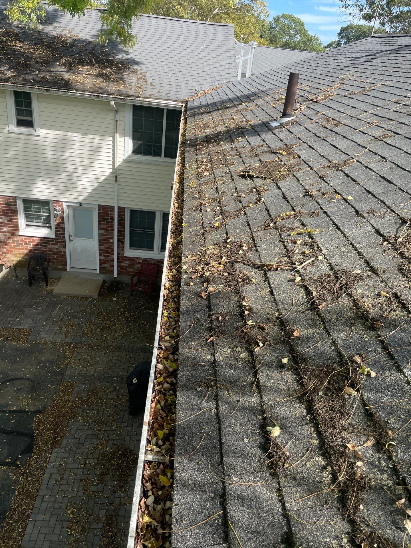 Commercial gutter cleaning Providence, RI before photo with filled gutters