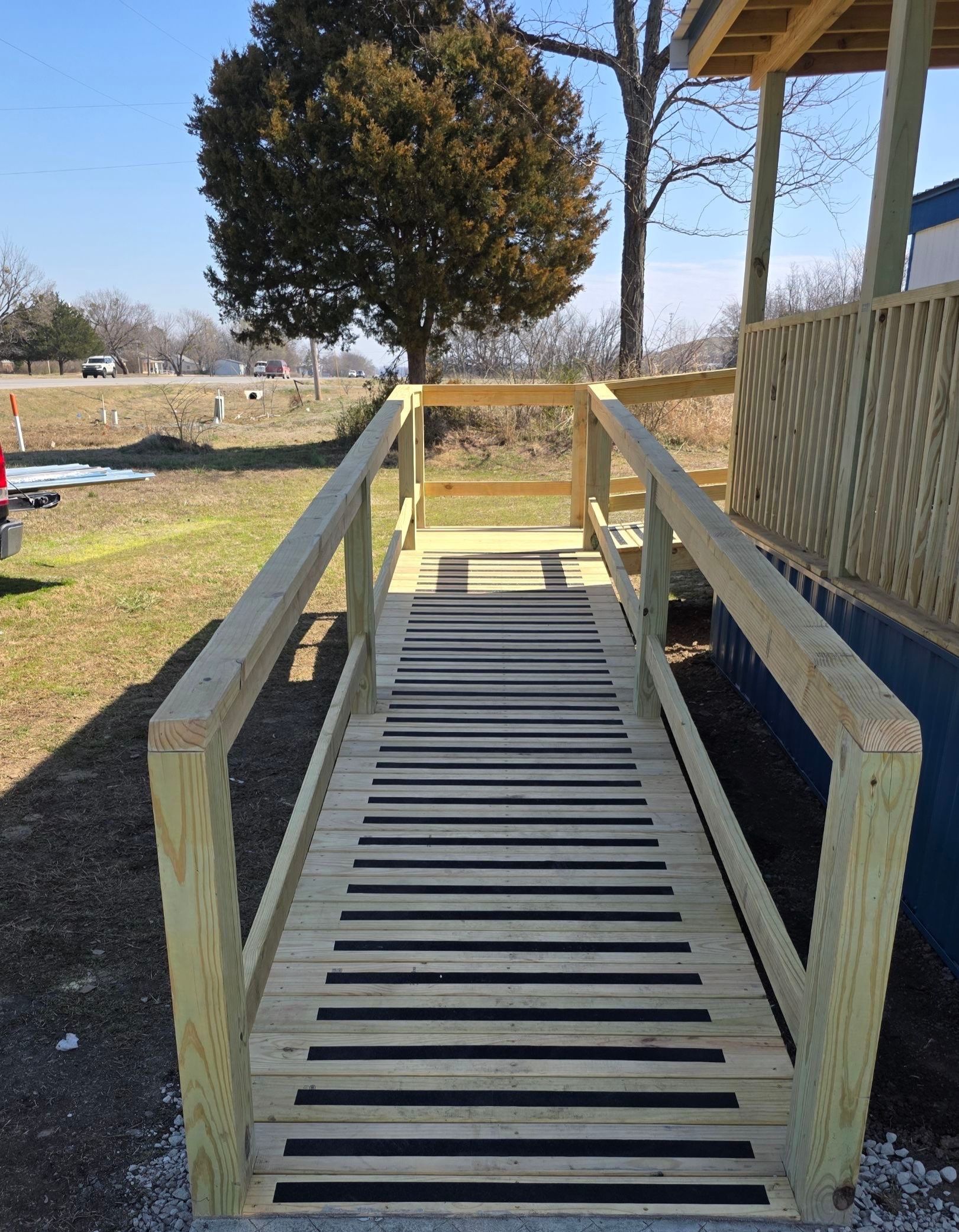 Covered Deck w/ ADA Ramp by In & Out Construction & Remodeling, LLC