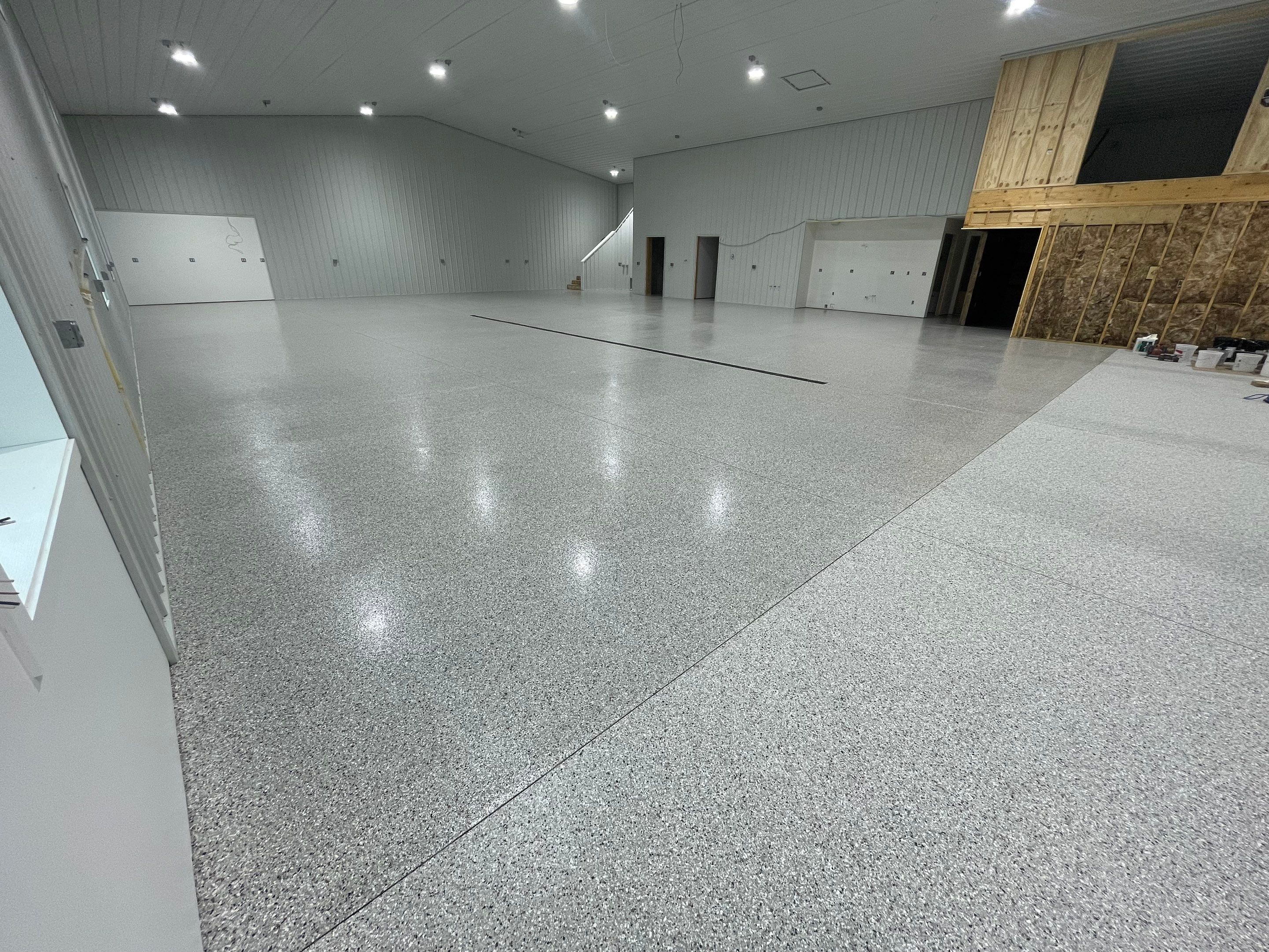 Custom Speckled Floor Coating for Large Montrose Shop by Select Painting, Coatings & Garage Cabinets