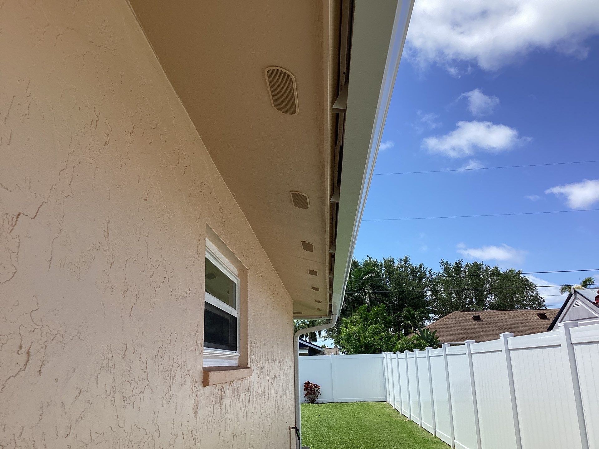 White K Style Seamless Gutters using 3X4 Elbow Downspout in Cape Coral FL by Gutter Professors