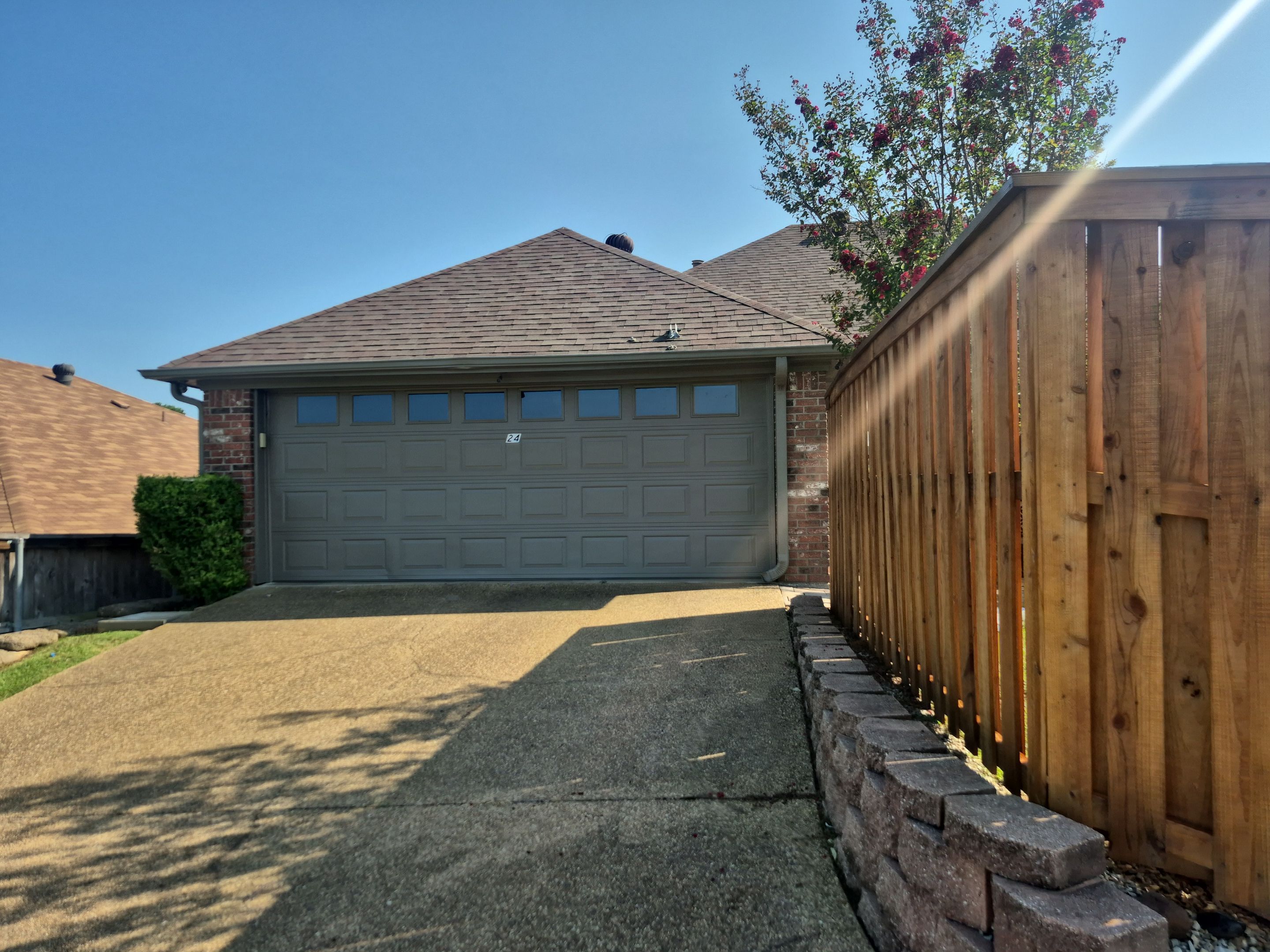 Exterior Painting in Longview, TX | Fresh Garage Door & Fence Renewal by Quality Coats Painting