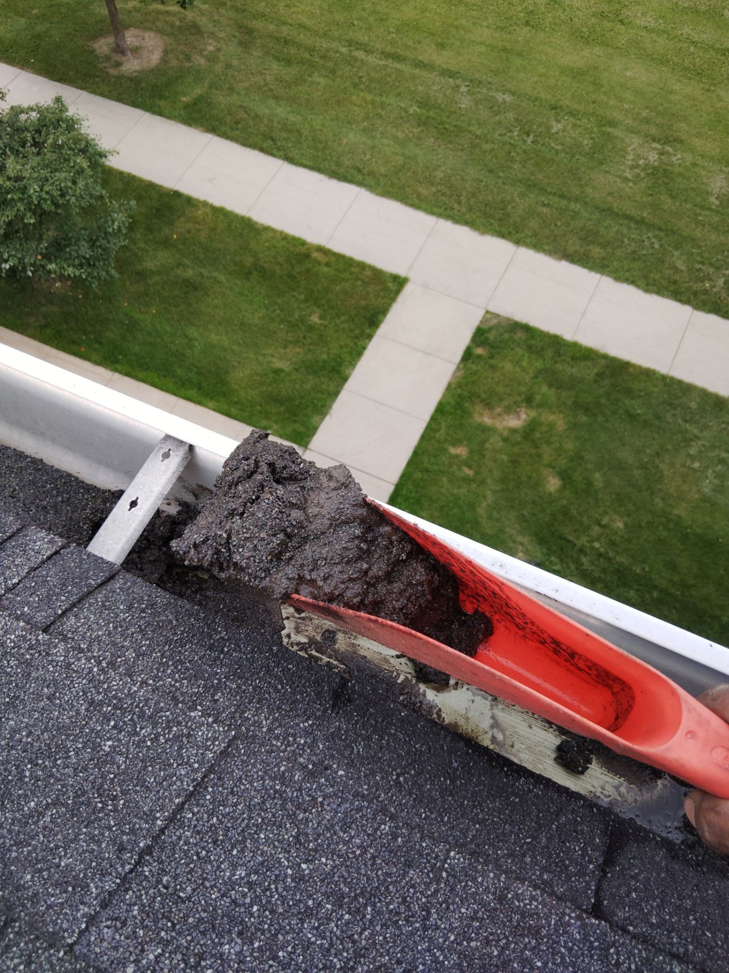 Commercial gutter cleaning La Crosse, WI before photo with filled gutters