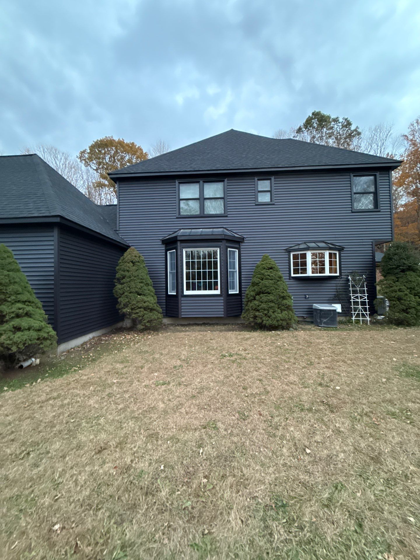 Bold Siding transformation with Cert Cedar Board & Batten S12, White, and Cert Monogram D/4 x 12'6" clapboard, Tuxedo by DiGiorgi Roofing and Siding Inc