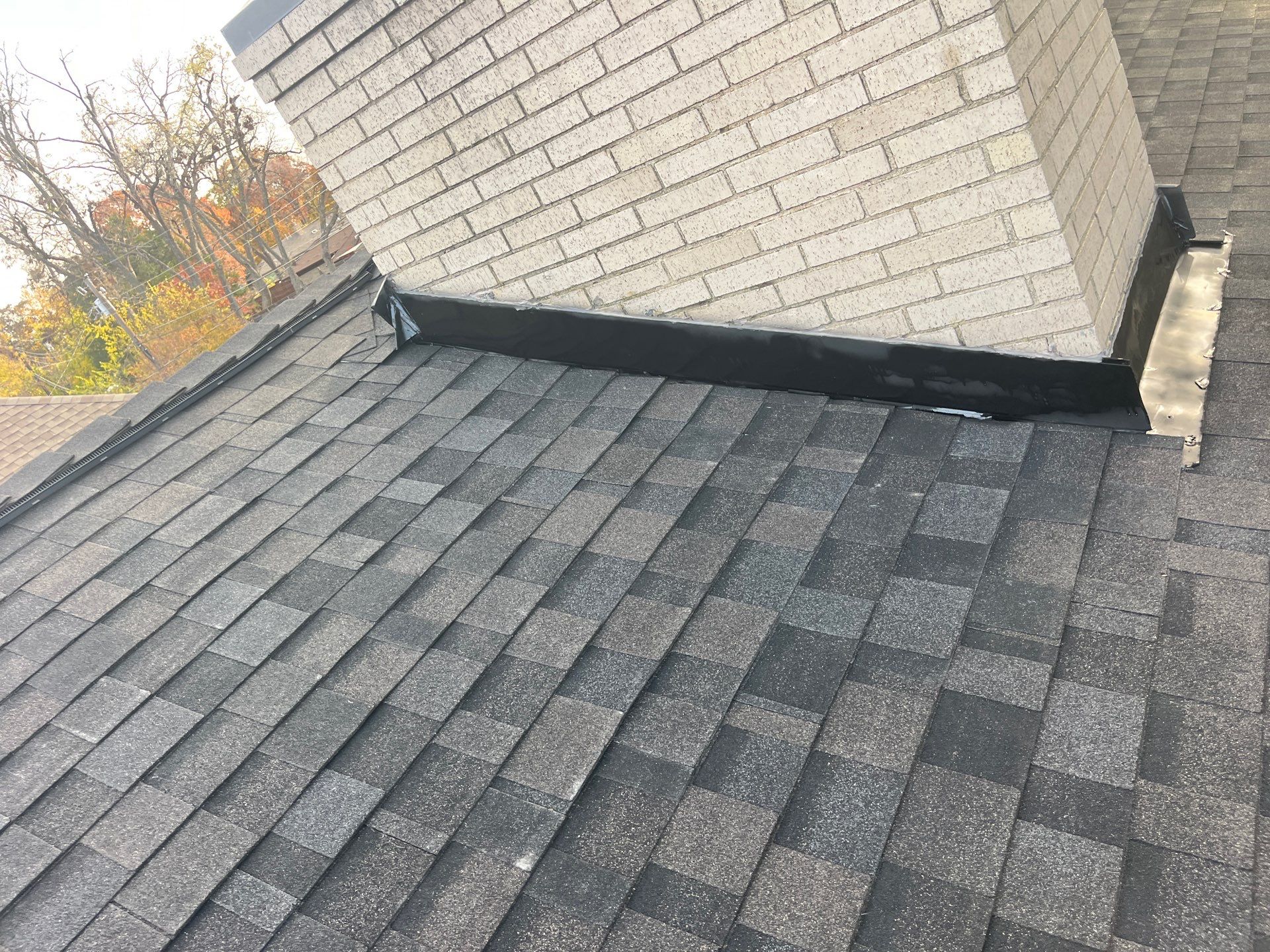 IKO Brownstone- White Brick  by Tejas Roofworks + Restoration