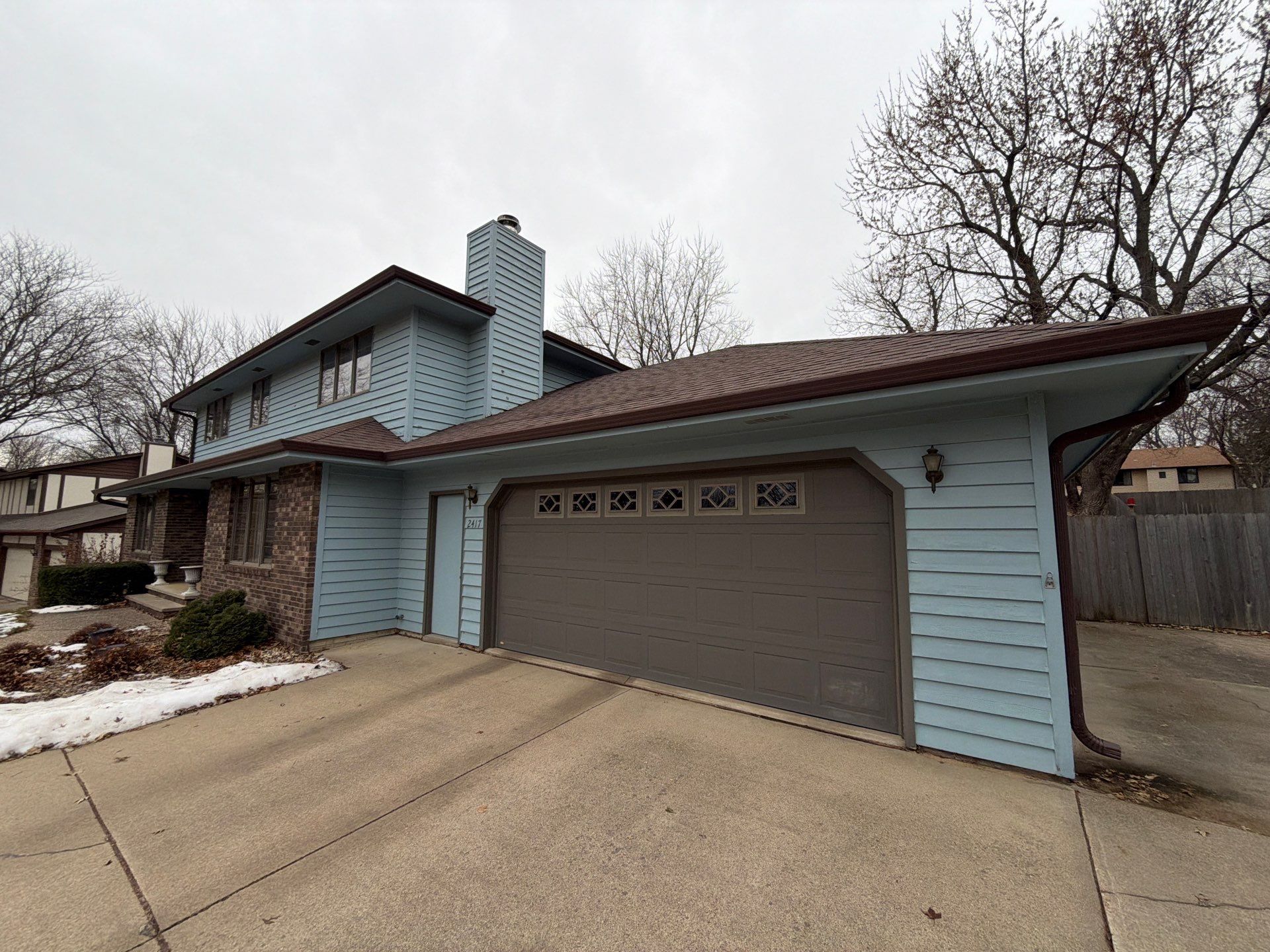 Full Exterior Home Painting and Siding Refurbishment in Sioux Falls by Select Painting, Coatings & Garage Cabinets