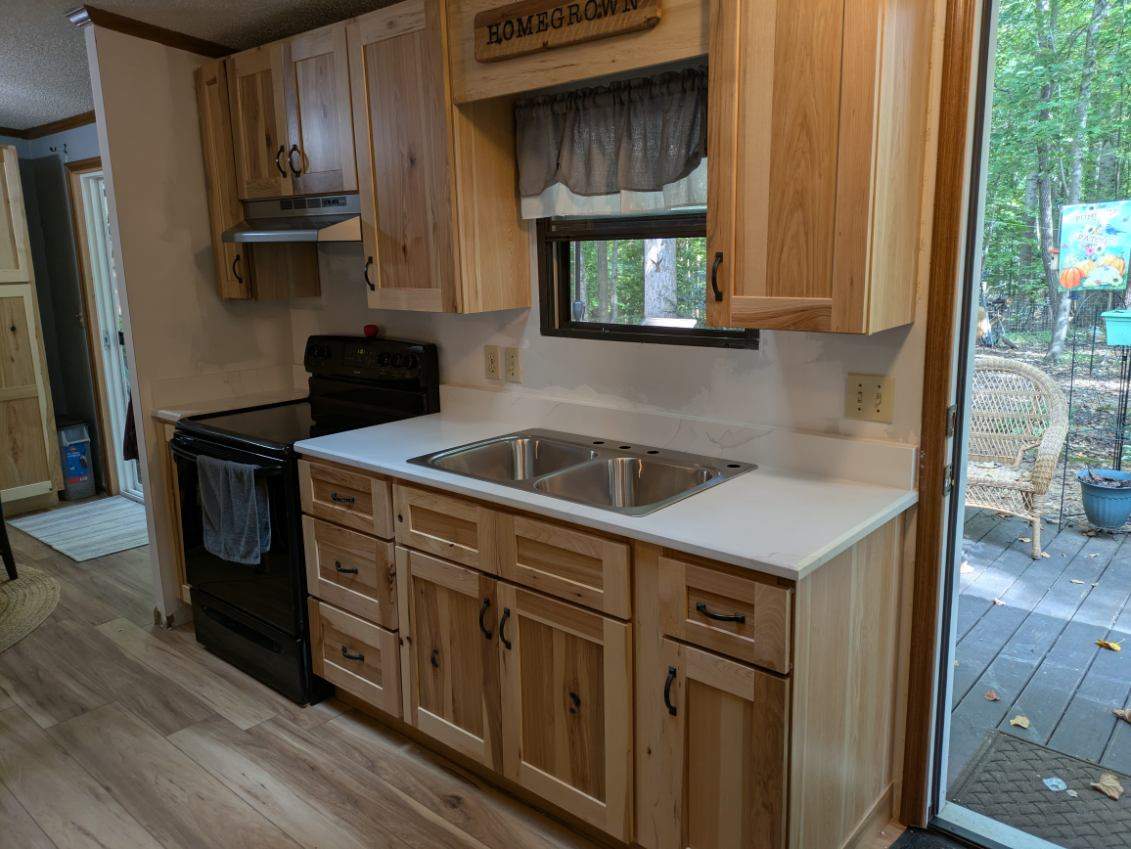 Stunning Kitchen Transformation with Raw Hickory Cabinets by A Step Above Handy LLC 
