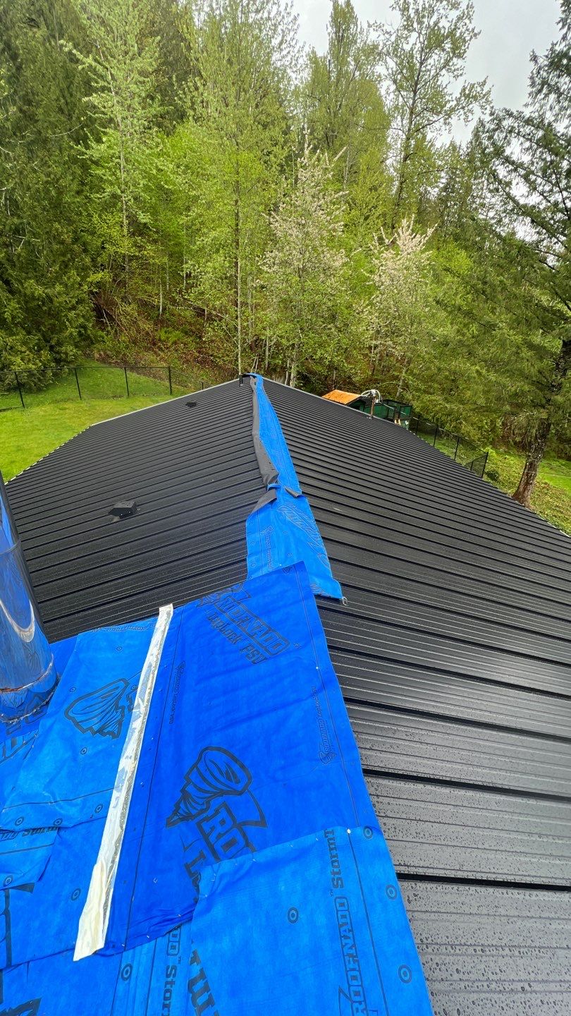 Residential ReRoofing Installation using 12" Prolok metal by Top Notch Roofing Inc