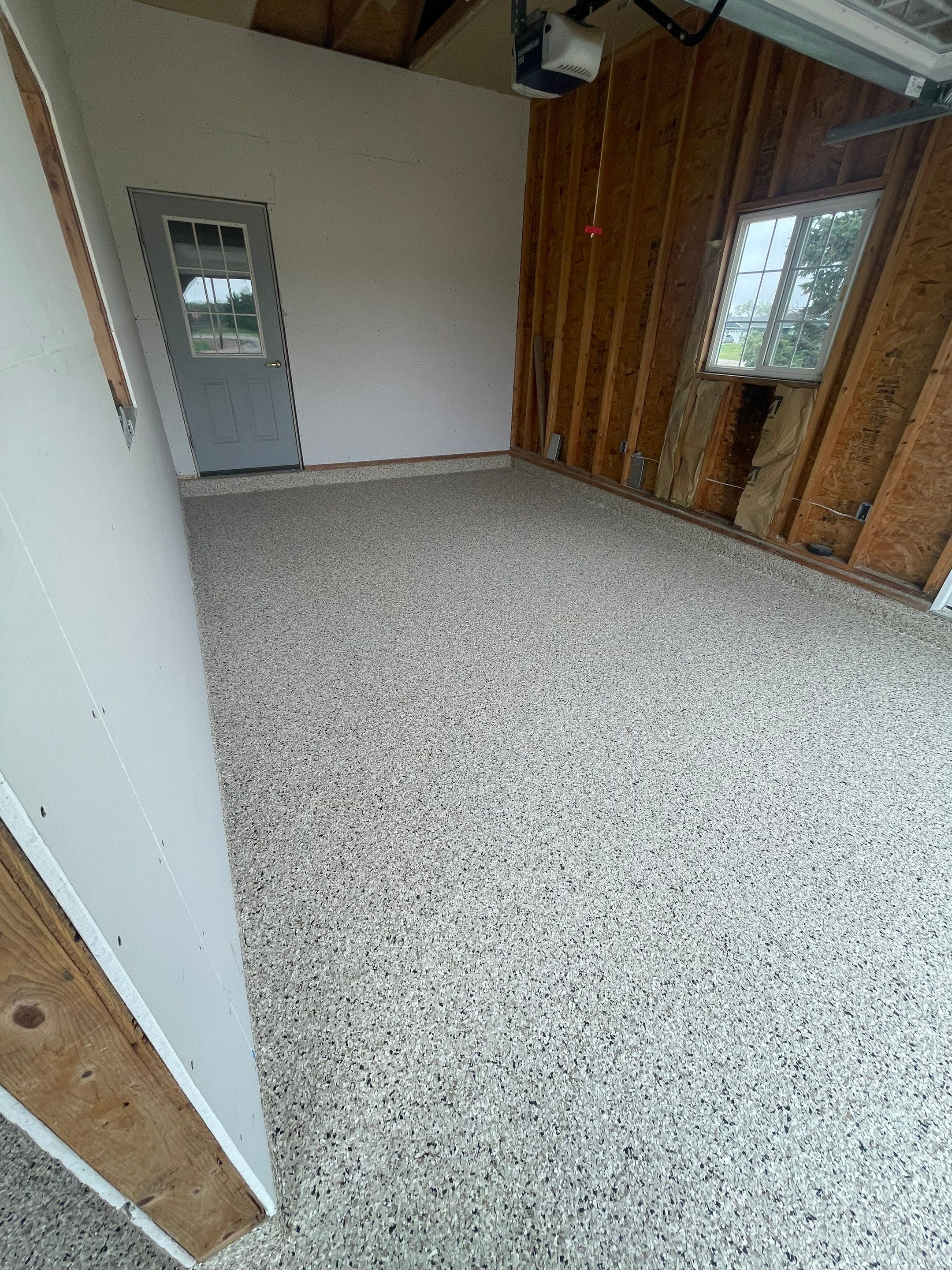 Speckled Epoxy Floor Coating Installation for Centerville Residential Garage by Select Painting, Coatings & Garage Cabinets