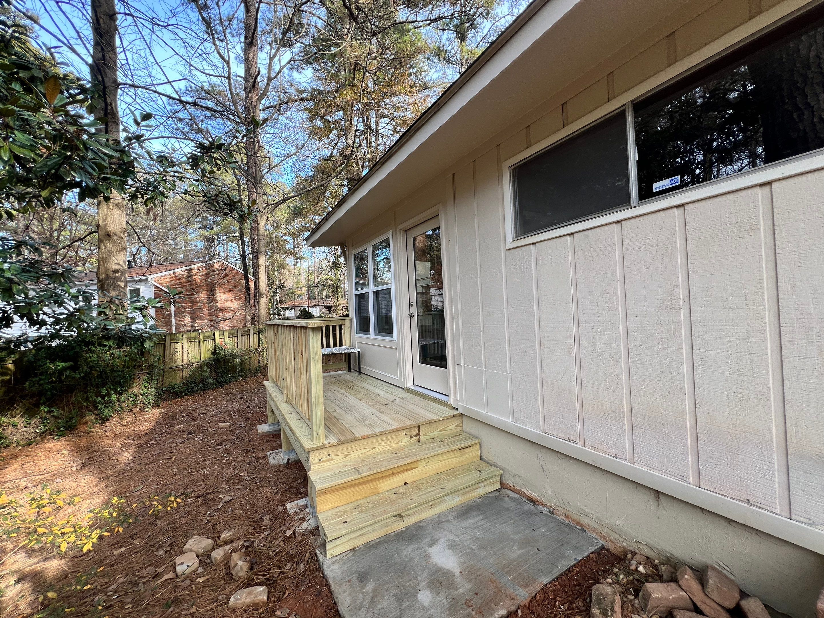 Sunroom Conversion and Pressure Treated Deck Installation in Doraville by Swift Home Renovations