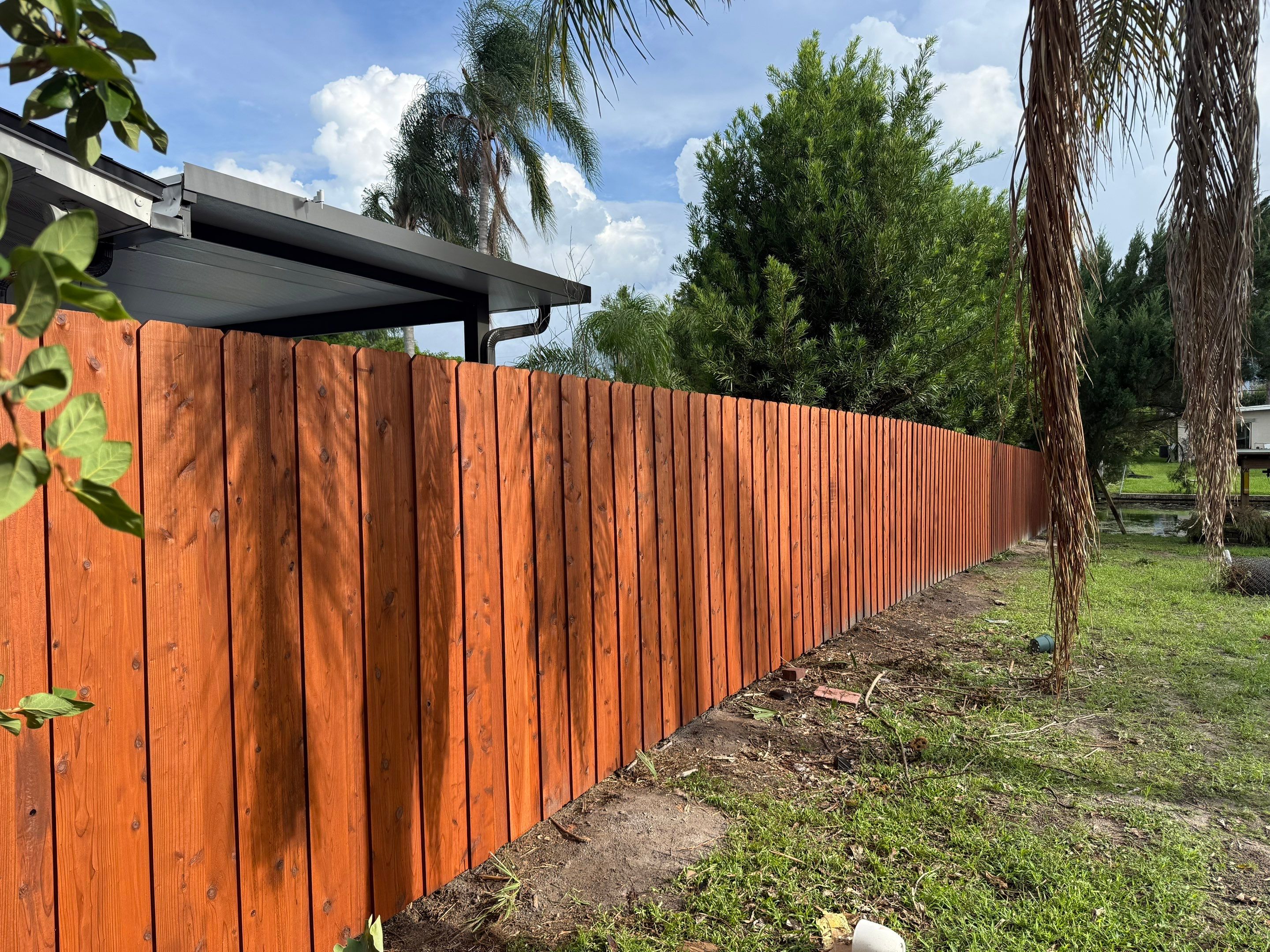 Waterfront Stained Board on Board Privacy Fence In Orlando by Asap fence and gates, LLC