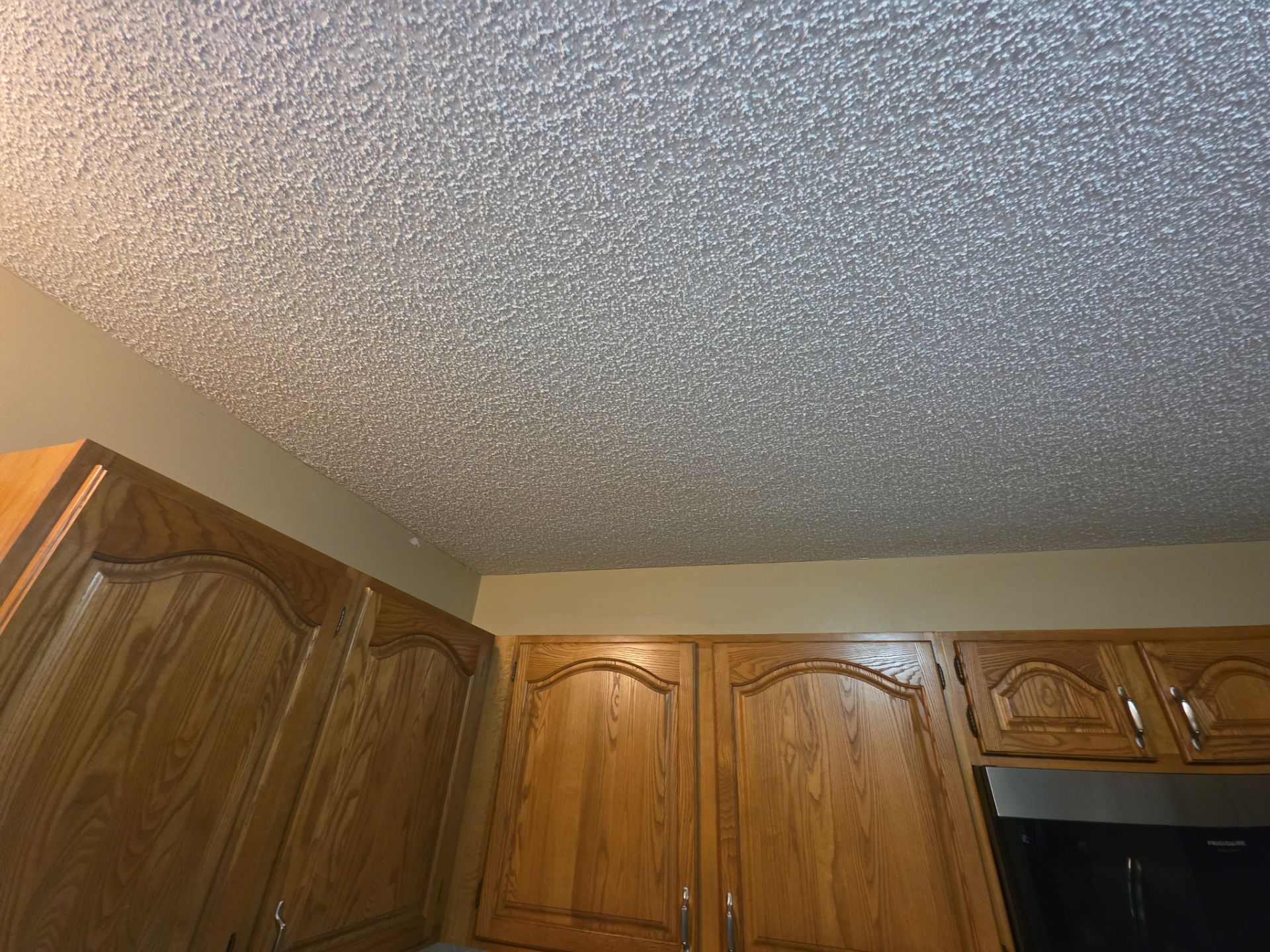 Norton Shores Kitchen Cabinet Painting and Deck Restoration Project by Gordon Painting