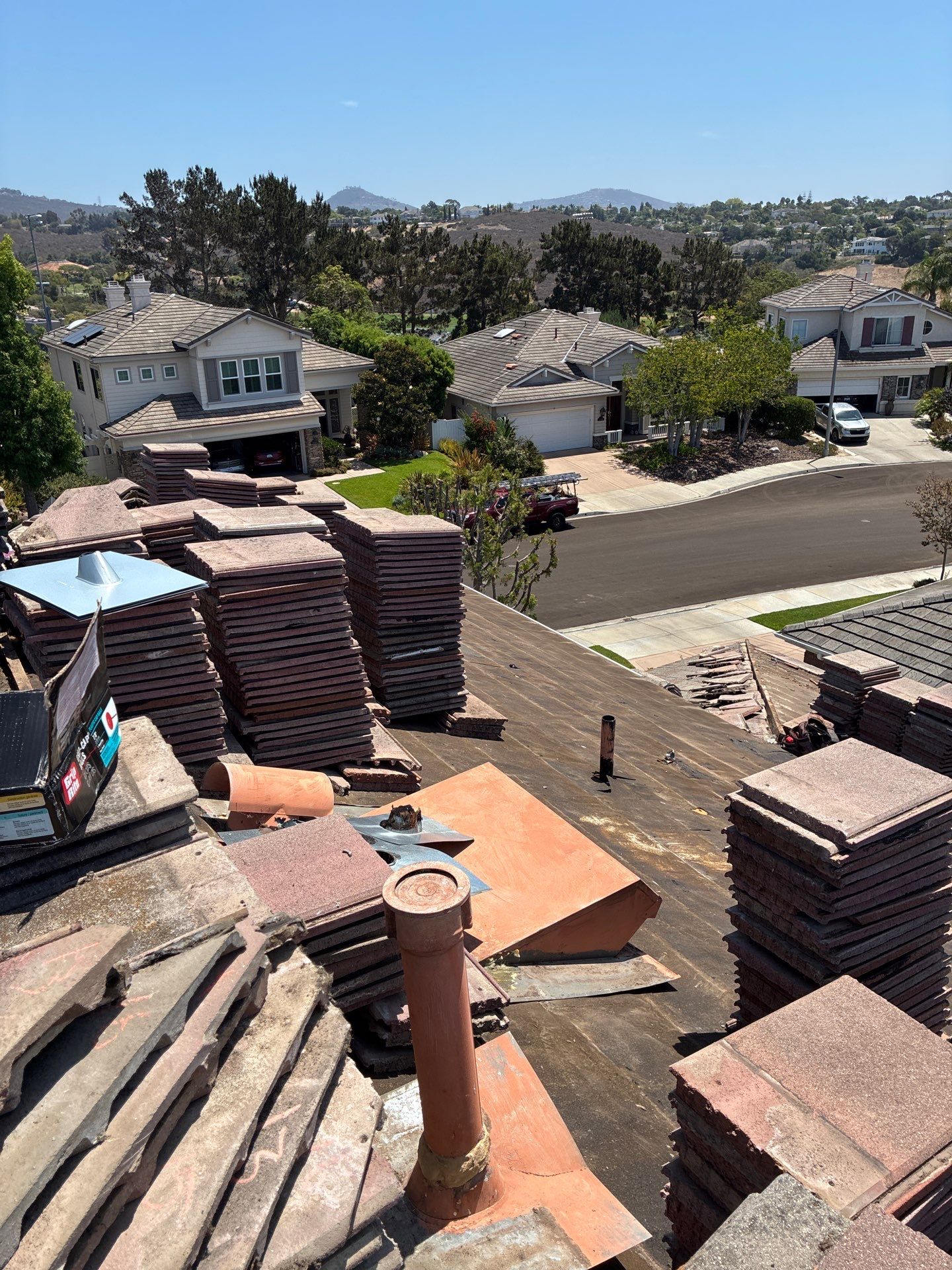Carlsbad Concrete Tile Roof Replacement with Copper Flashing and Skylights by Reliable Roofing San Diego Inc.