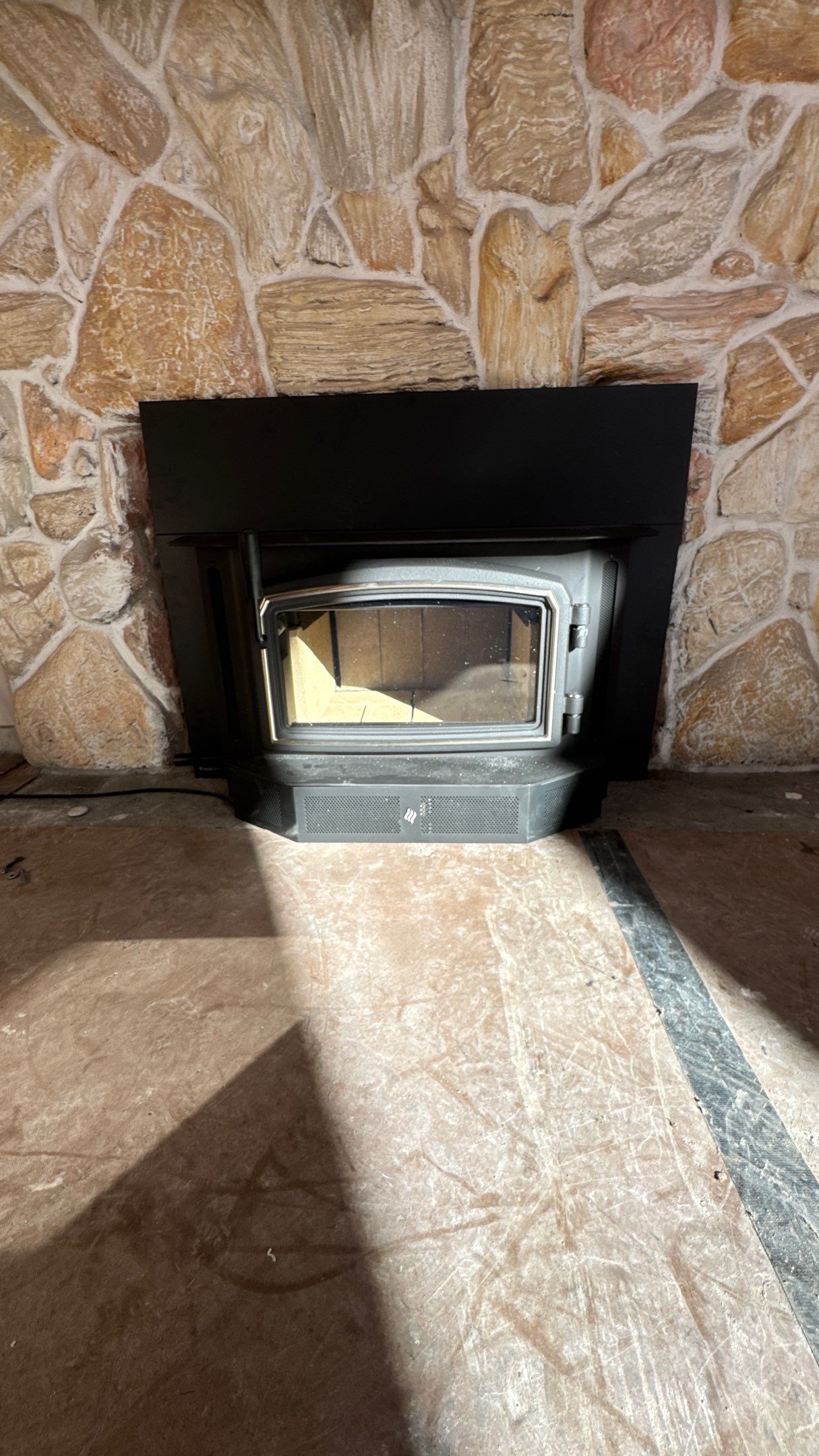 Wood stove insert  by Neighborhood Chimney Services 