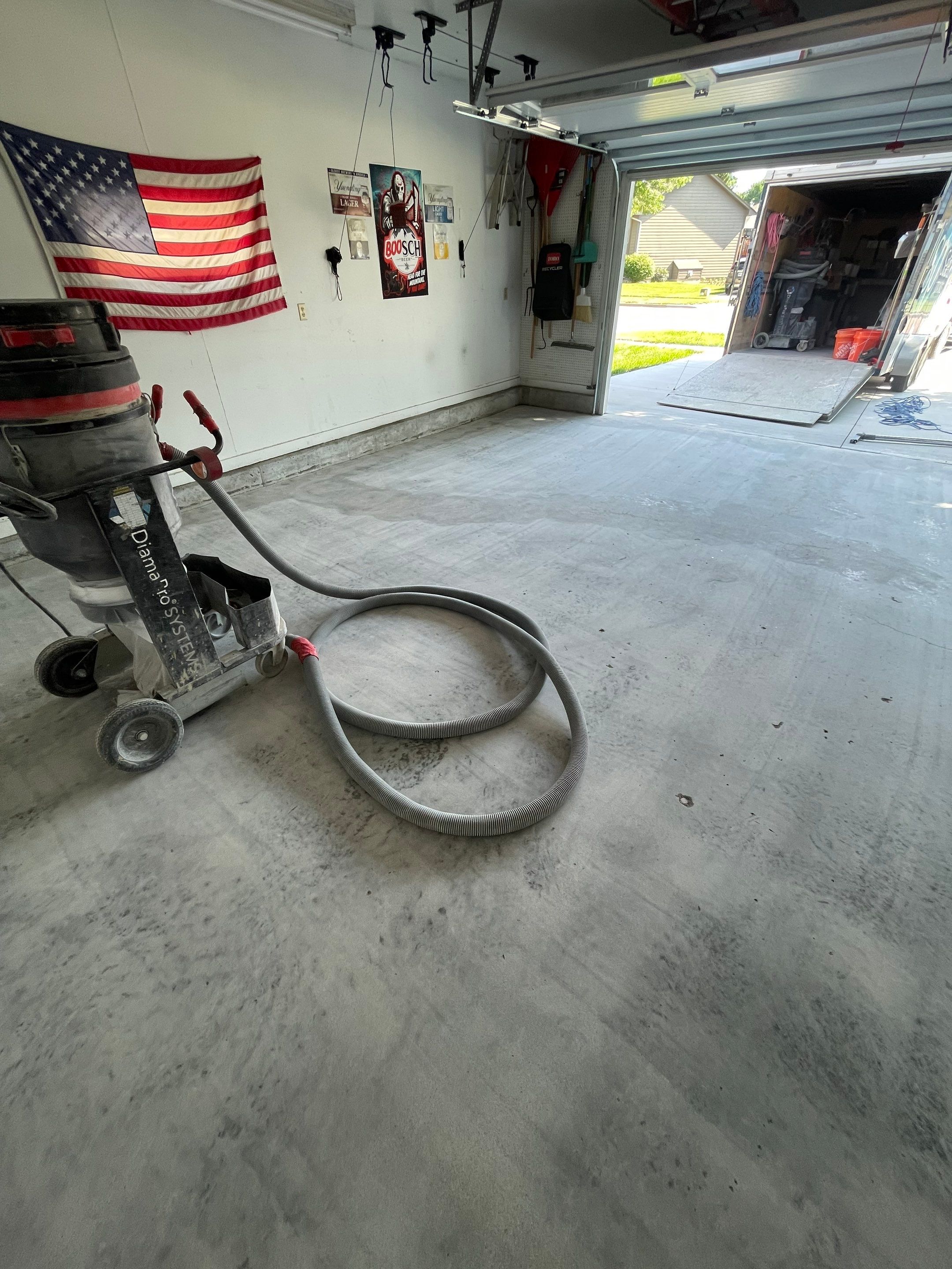 Residential Garage Floor Coating with Feather Grey Finish in Sioux Falls by Select Painting, Coatings & Garage Cabinets