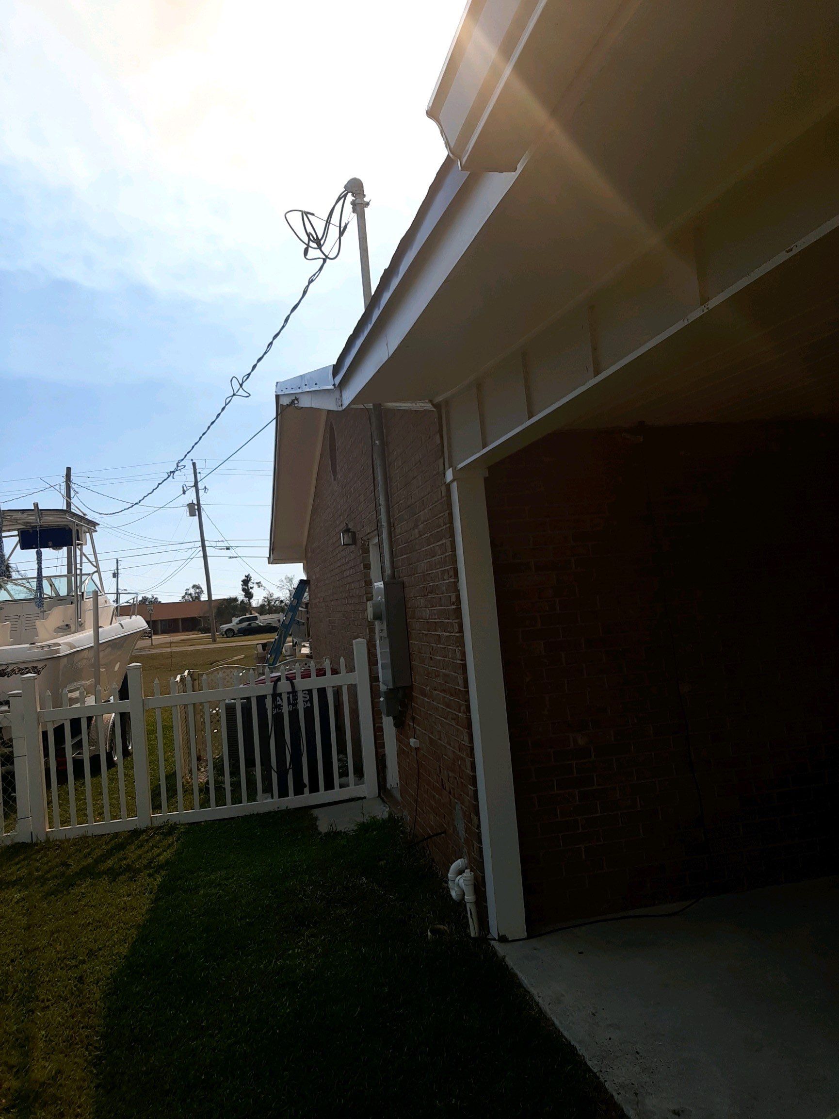 Soffit and Fascia Installation Using White Vinyl Soffit by Gutter Professors