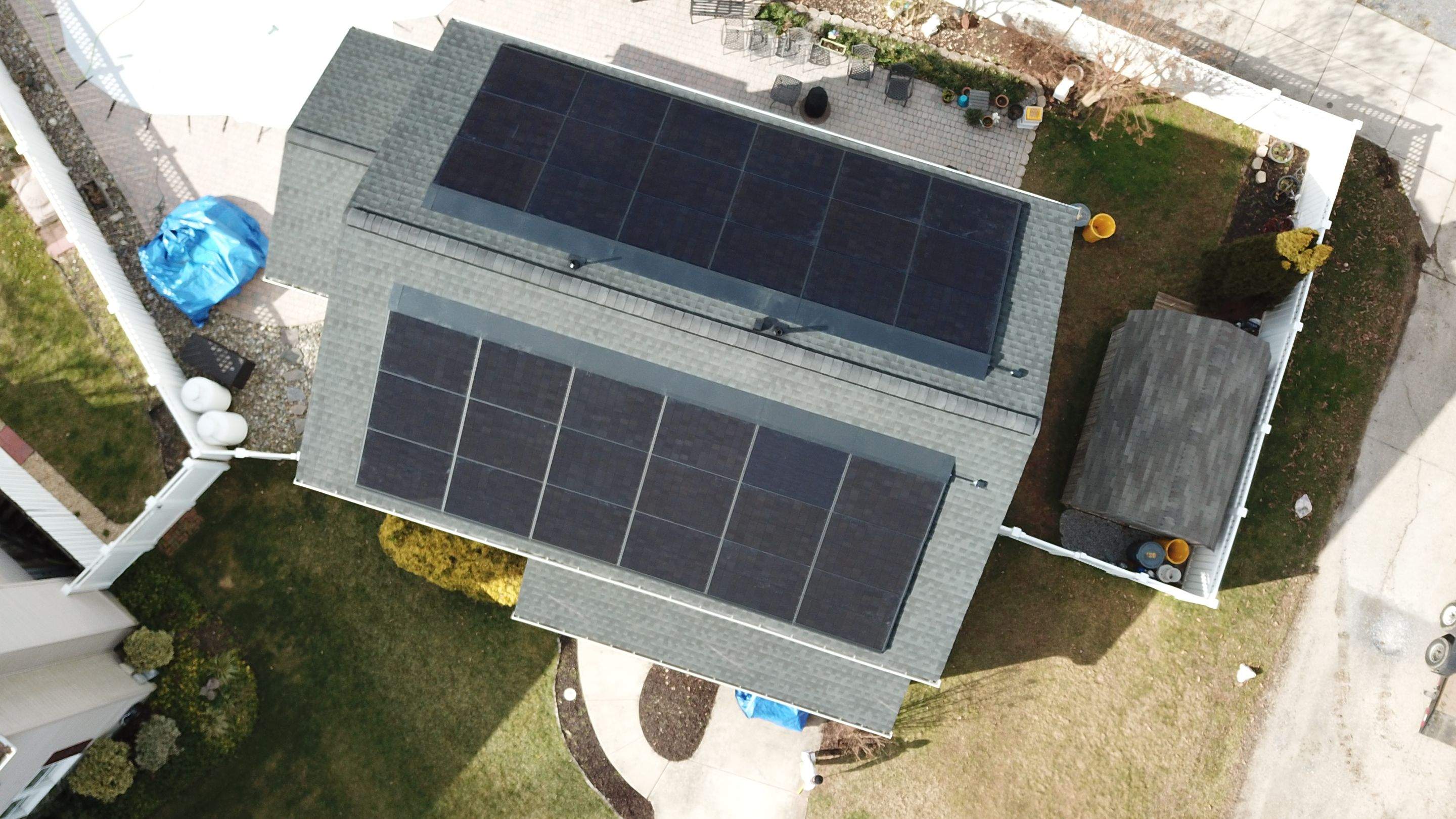 Roof Replacement with GAF Decotech integrated solar panels by American Home Contractors