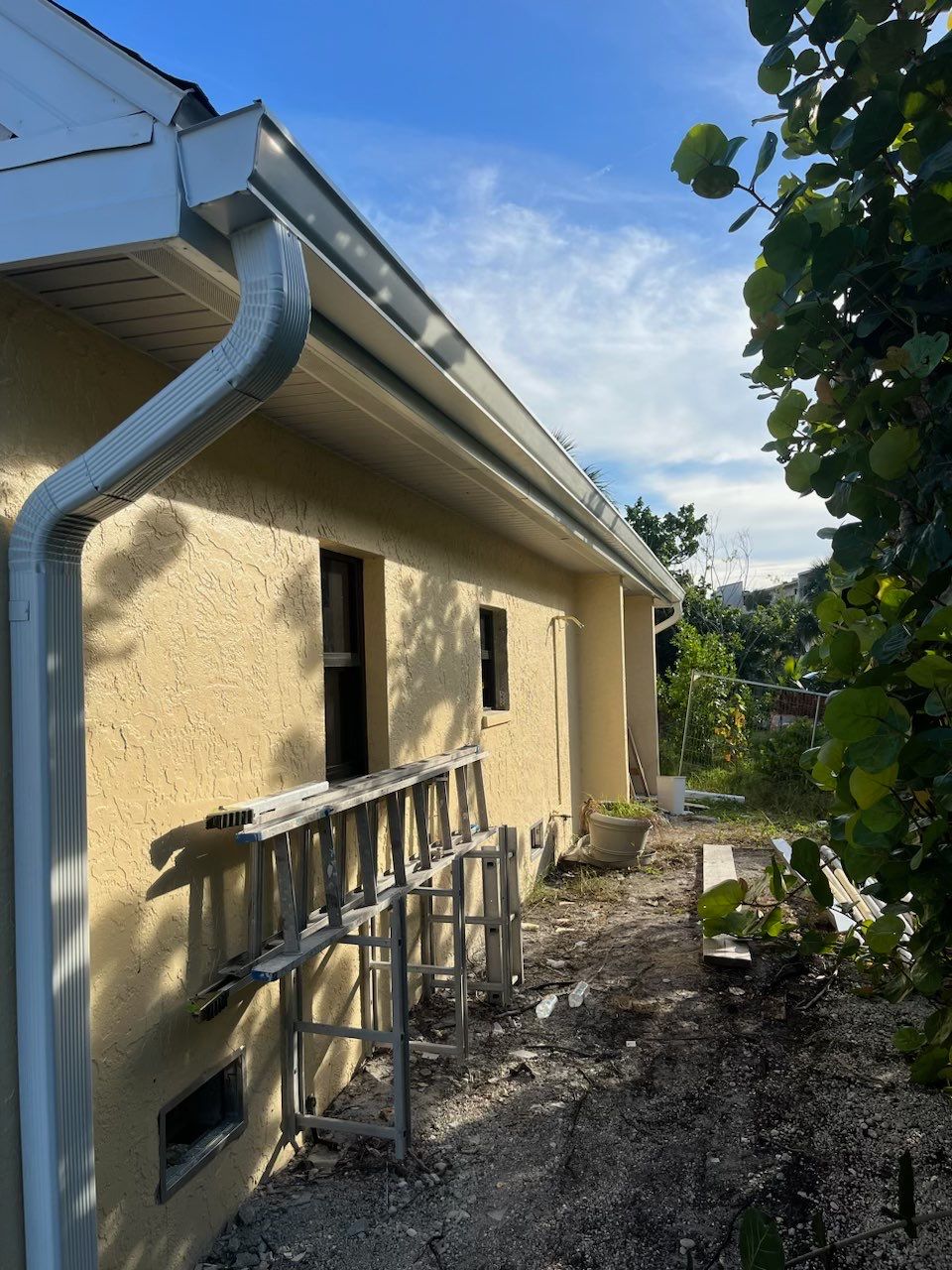K-Style Seamless Gutter Installation using White Seamless Gutters in Sanibel FL by Gutter Professors