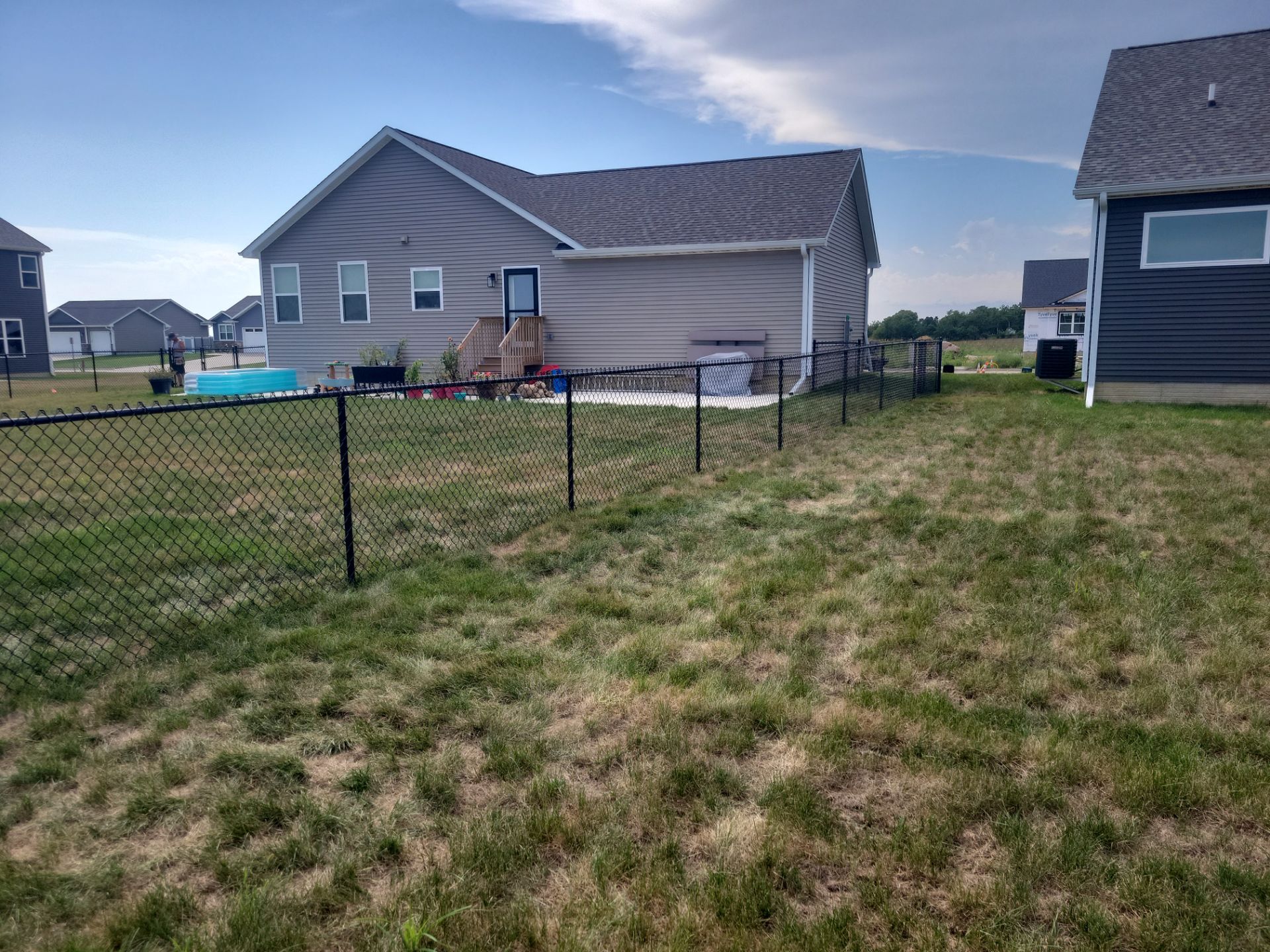 Residential Black Chain Link Fence Installation in Jesup by Perfect Picket Fence and Stain