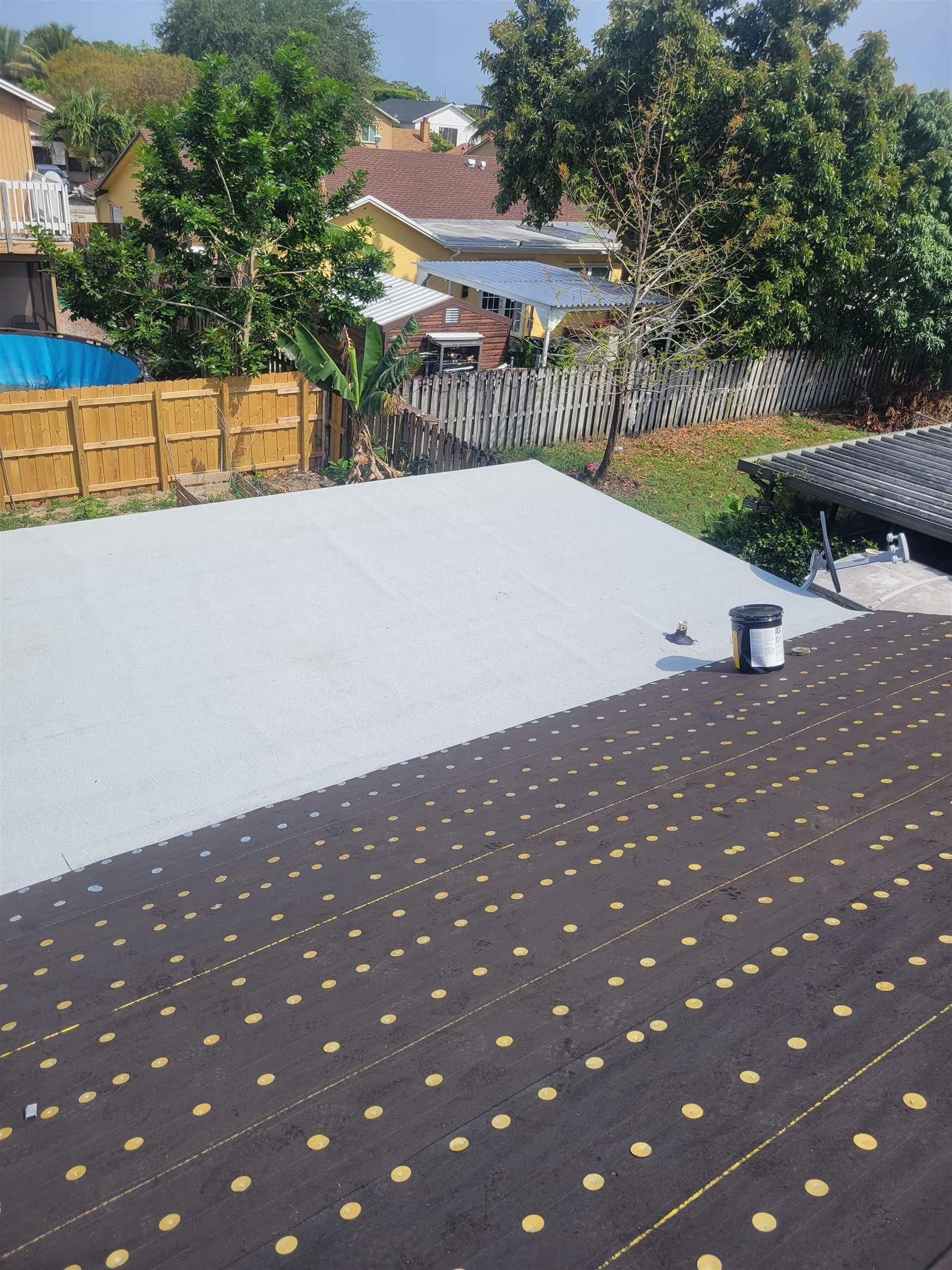 Standing Seam Metal & Flat Re-Roof using 1.5" Nail Strip 24ga Solar White Kynar Coated Standing Seam Metal Panels by Morton Roofing, Inc.