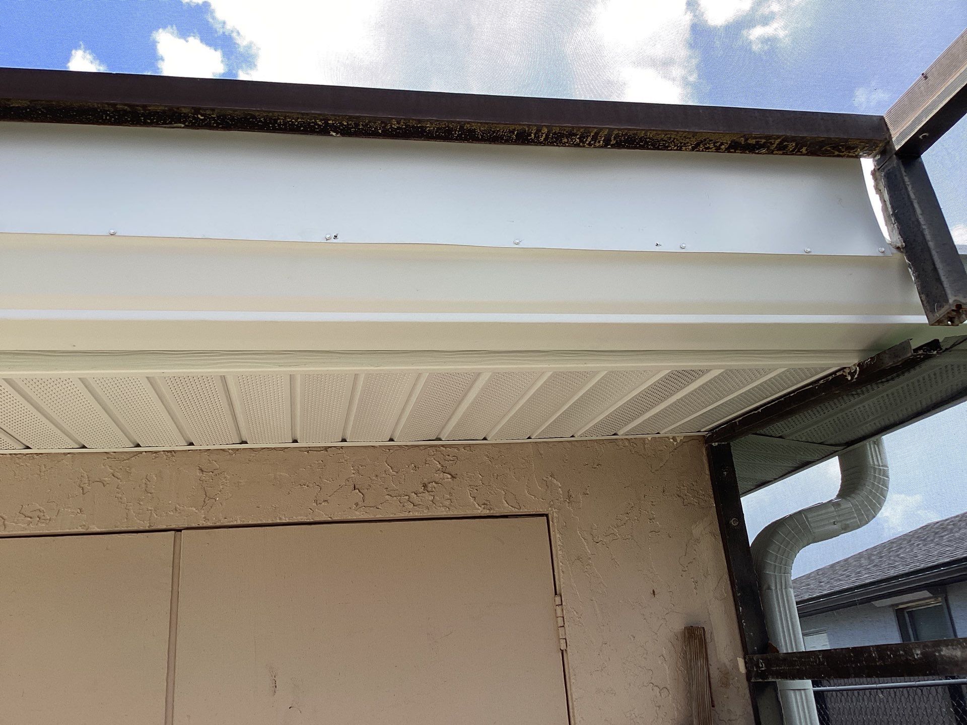 White Seamless Gutters and Splash Guards in Fort Myers FL by Gutter Professor by Gutter Professors