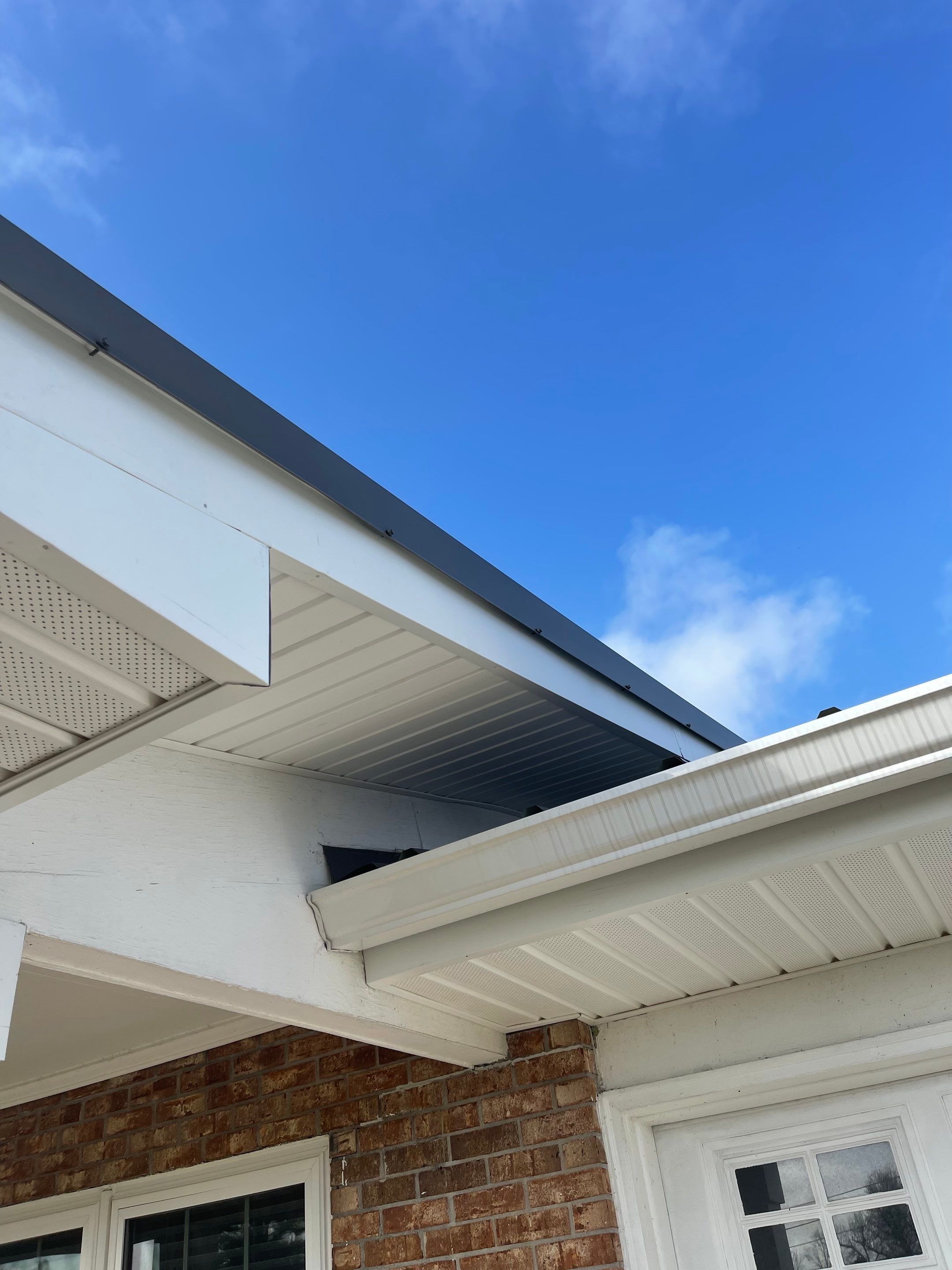 Soffit and Fascia Installation Using White Vinyl Soffit by Gutter Professors