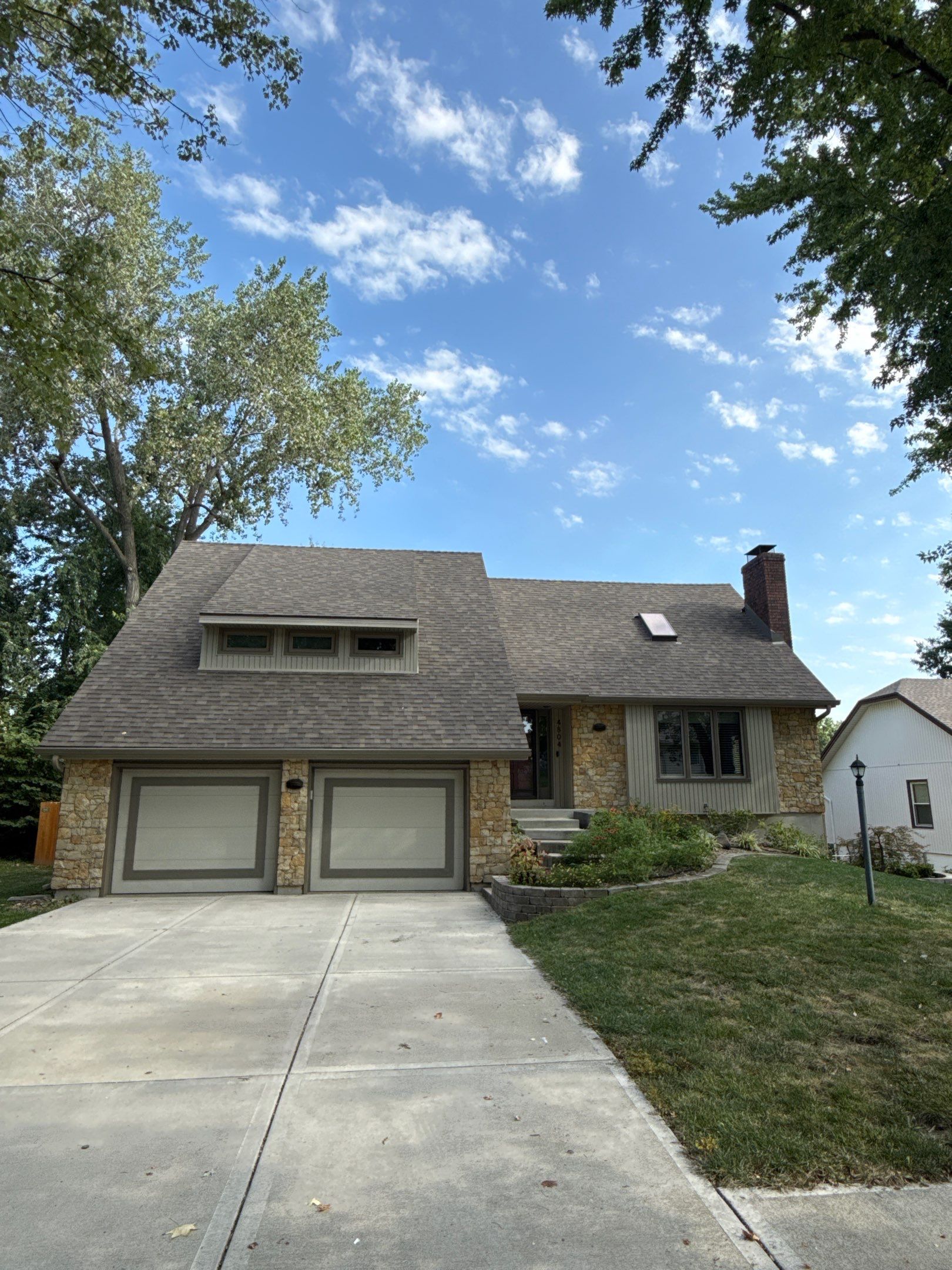Comprehensive Kansas City Exterior Remodel Featuring Board And Batten Siding by EEC Windows, Siding & Roofing