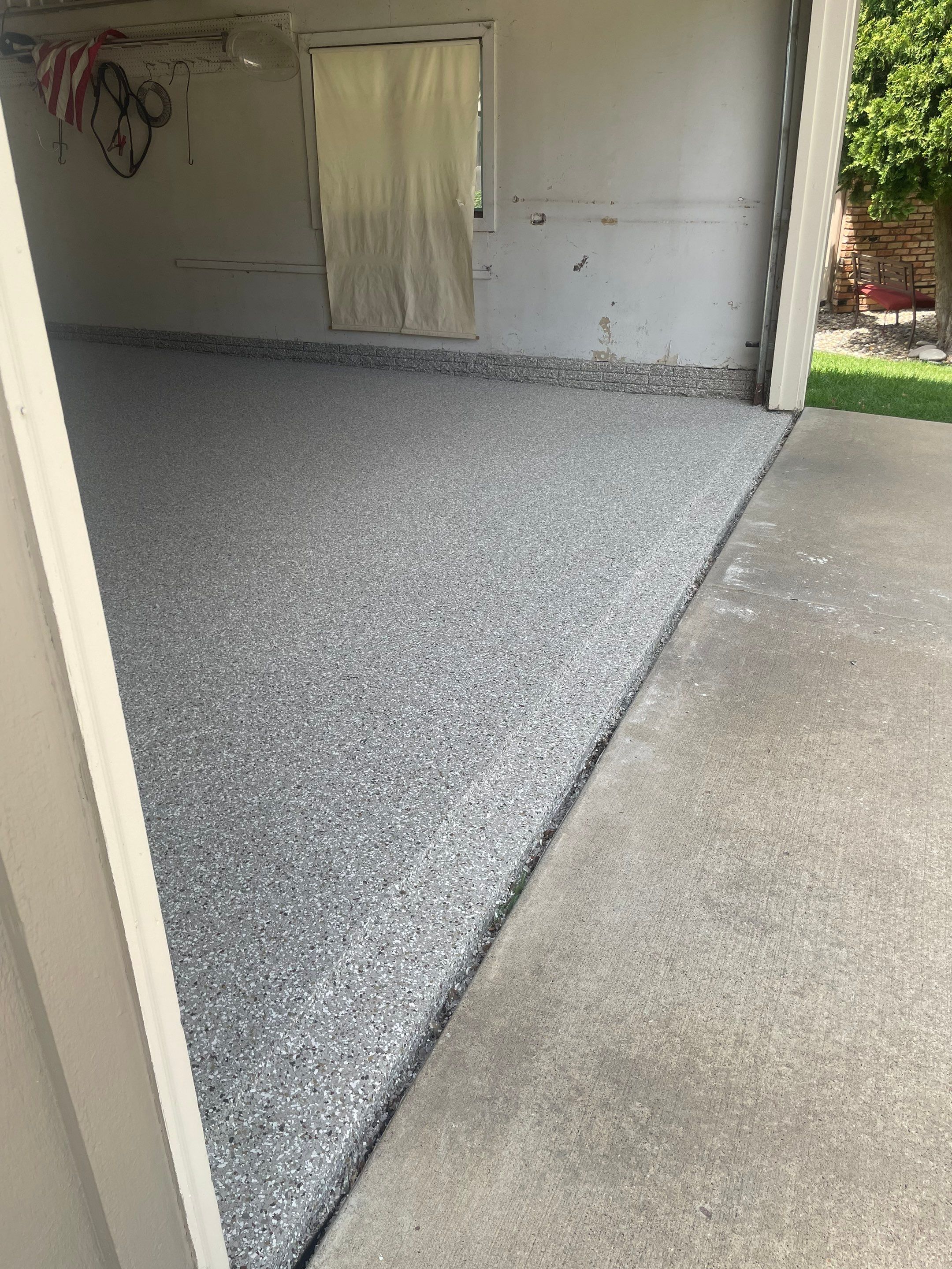 Custom Creekbed Garage Floor Coating in Sioux Falls by Select Painting, Coatings & Garage Cabinets