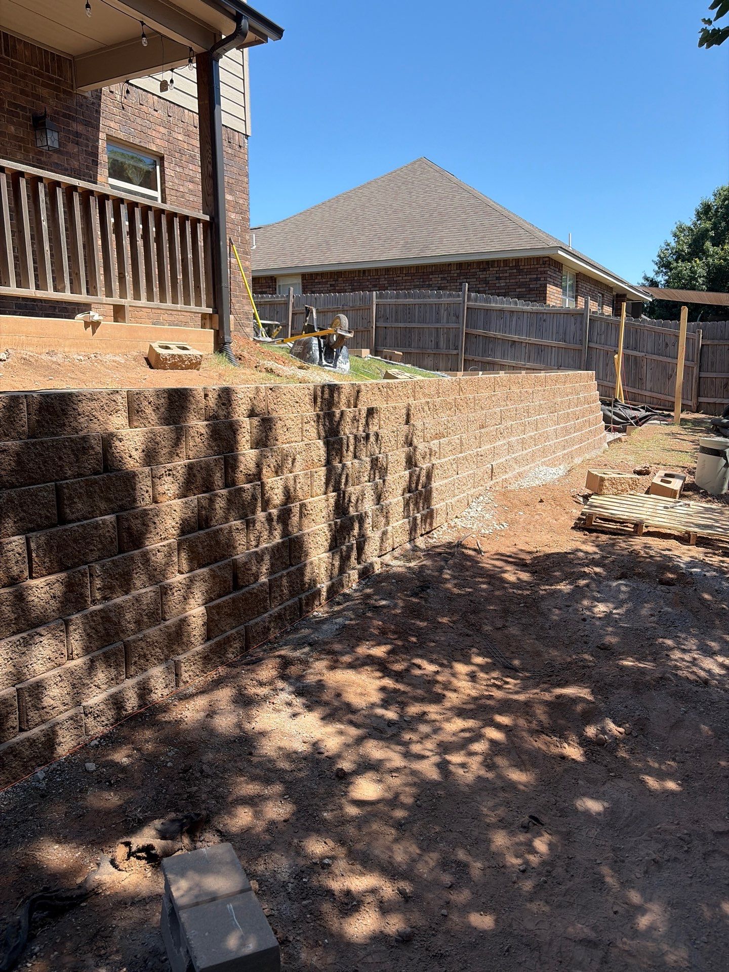 Custom Segmental Block Retaining Wall and Sod Installation in Lawton by Clays Services Inc