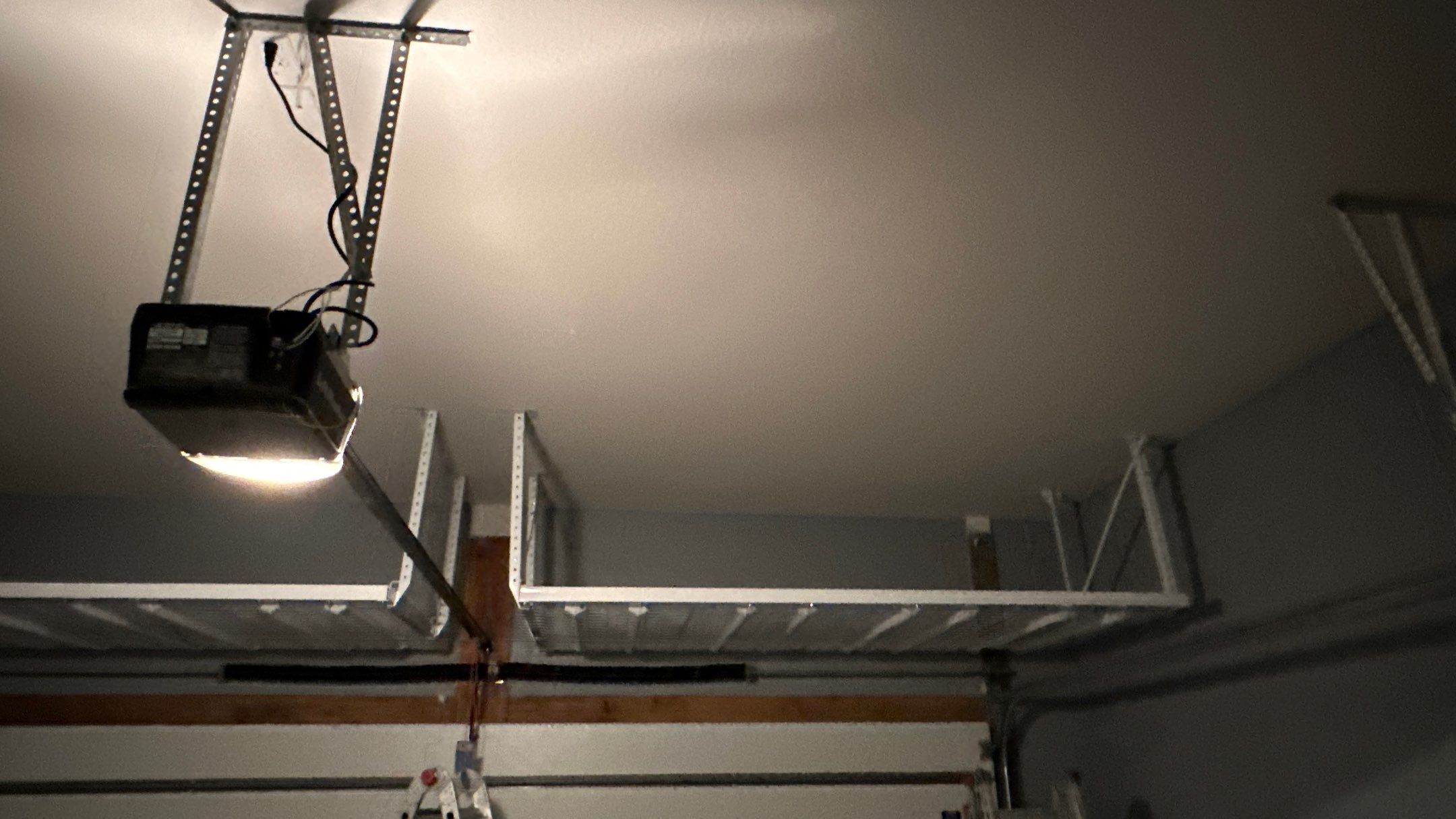 Overhead racks are a must to maximize your storage.  by Banner Garage