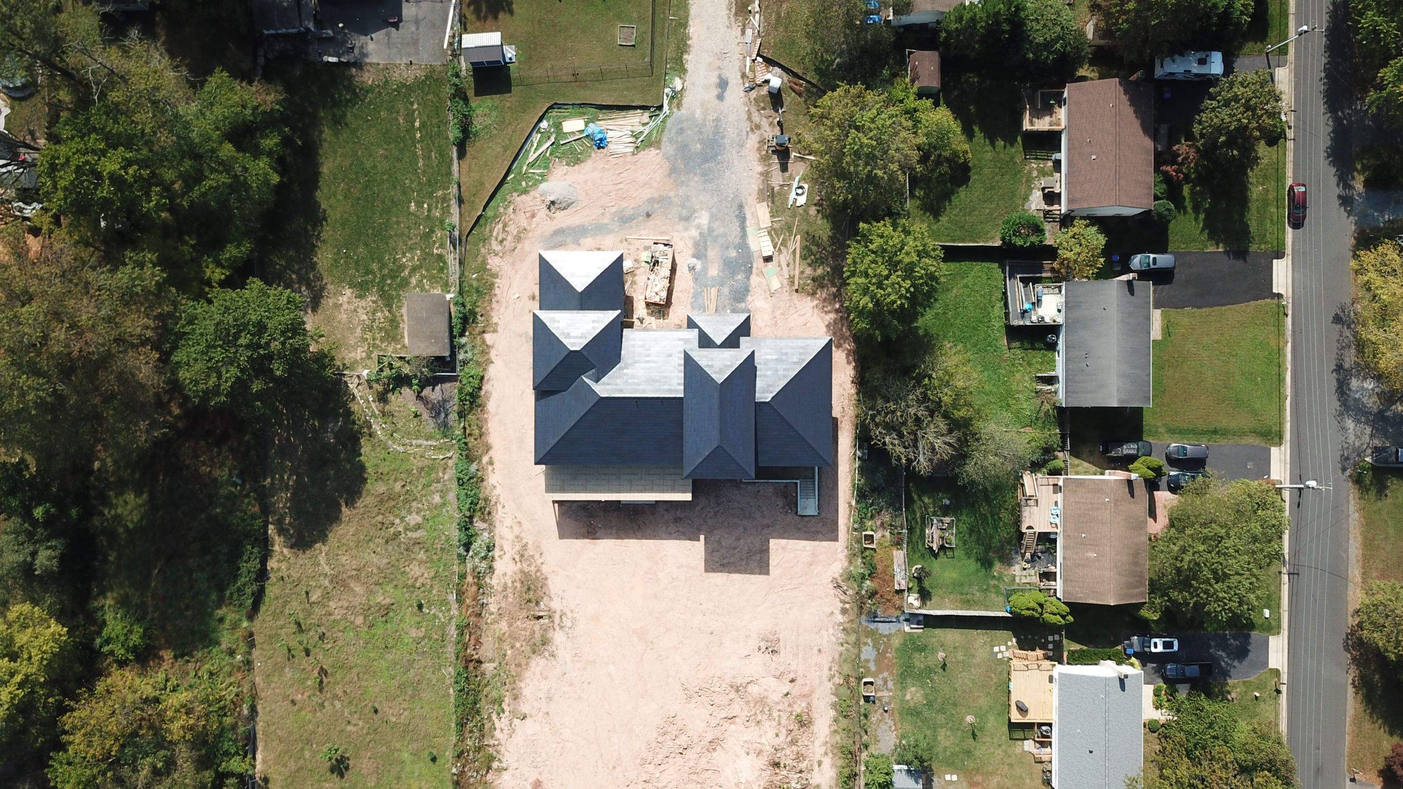 Tesla Solar Roof  using Tesla Solar Roof V3 tiles by American Home Contractors