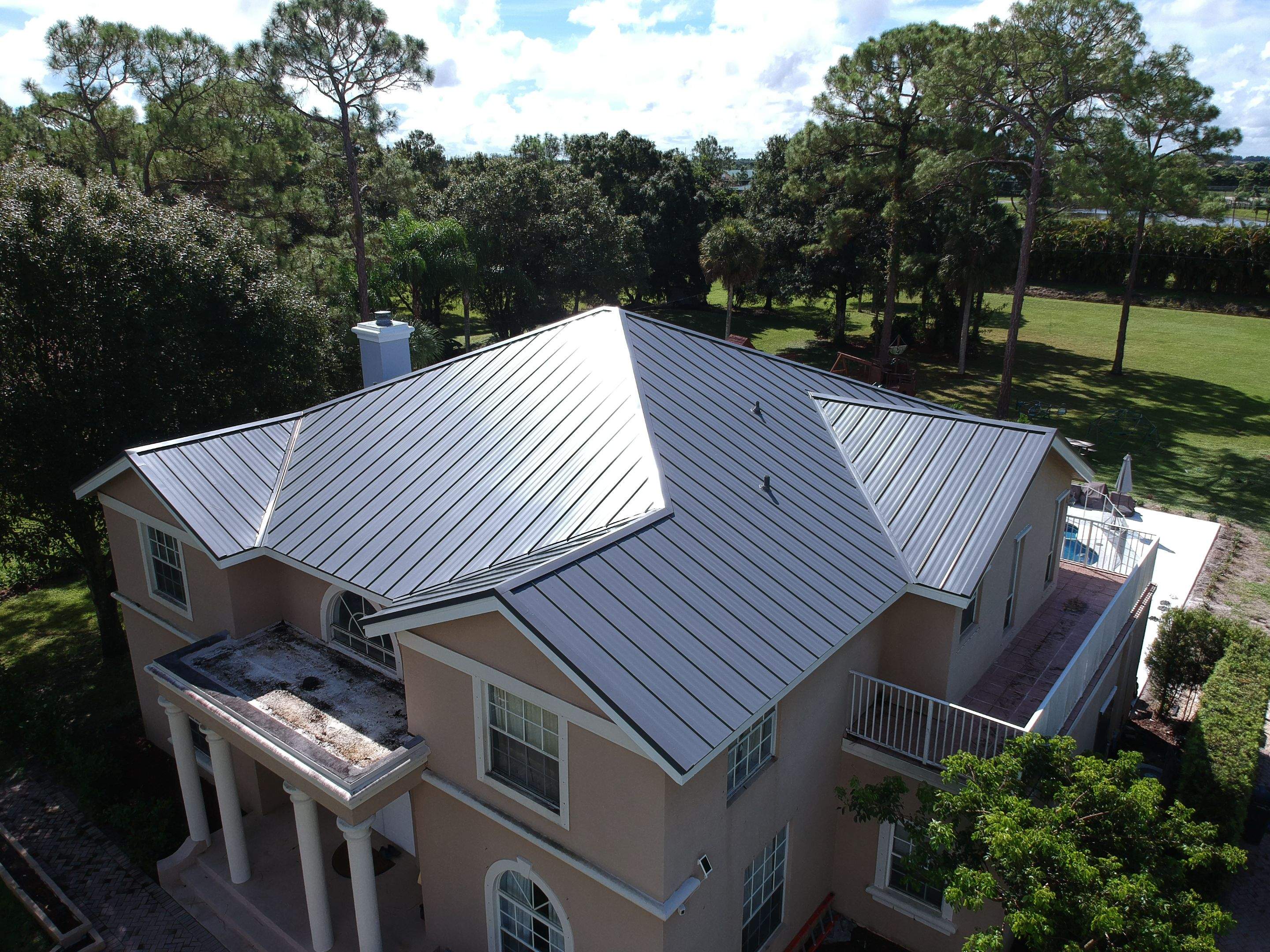 Residential Roofing Installation using 1" Nail strip metal roof by BLUES BROTHERS CONSTRUCTION CORP