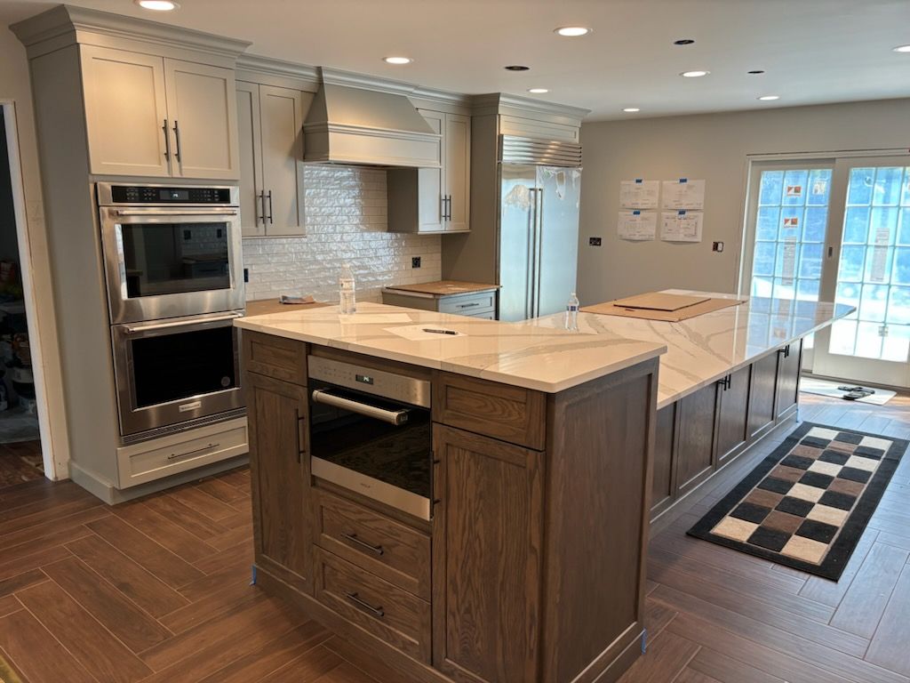 Herringbone Floor install w/ Subway Tile Backsplash by Footprints Floors Morristown