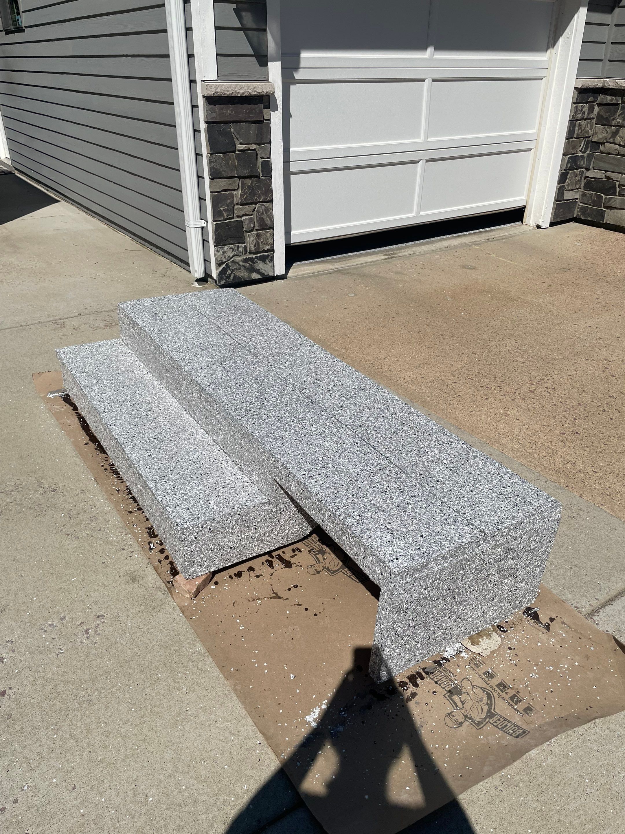 Feather Grey Garage Floor Coating Installation in Sioux Falls by Select Painting, Coatings & Garage Cabinets