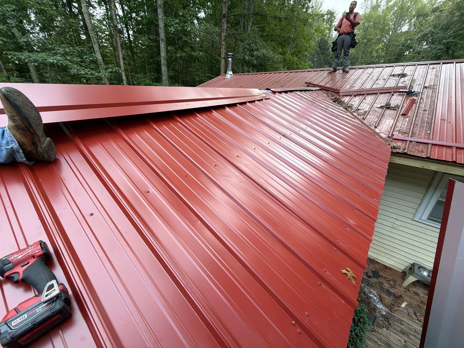 Red Metal Roof Restoration and Wood Fascia Replacement in Barboursville by Cade Construction