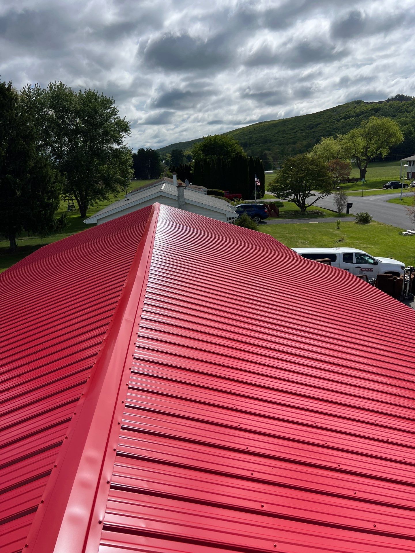 Red ABM Panel Metal Roofing Installation on Elizabethville Ranch Home by Esh Builders