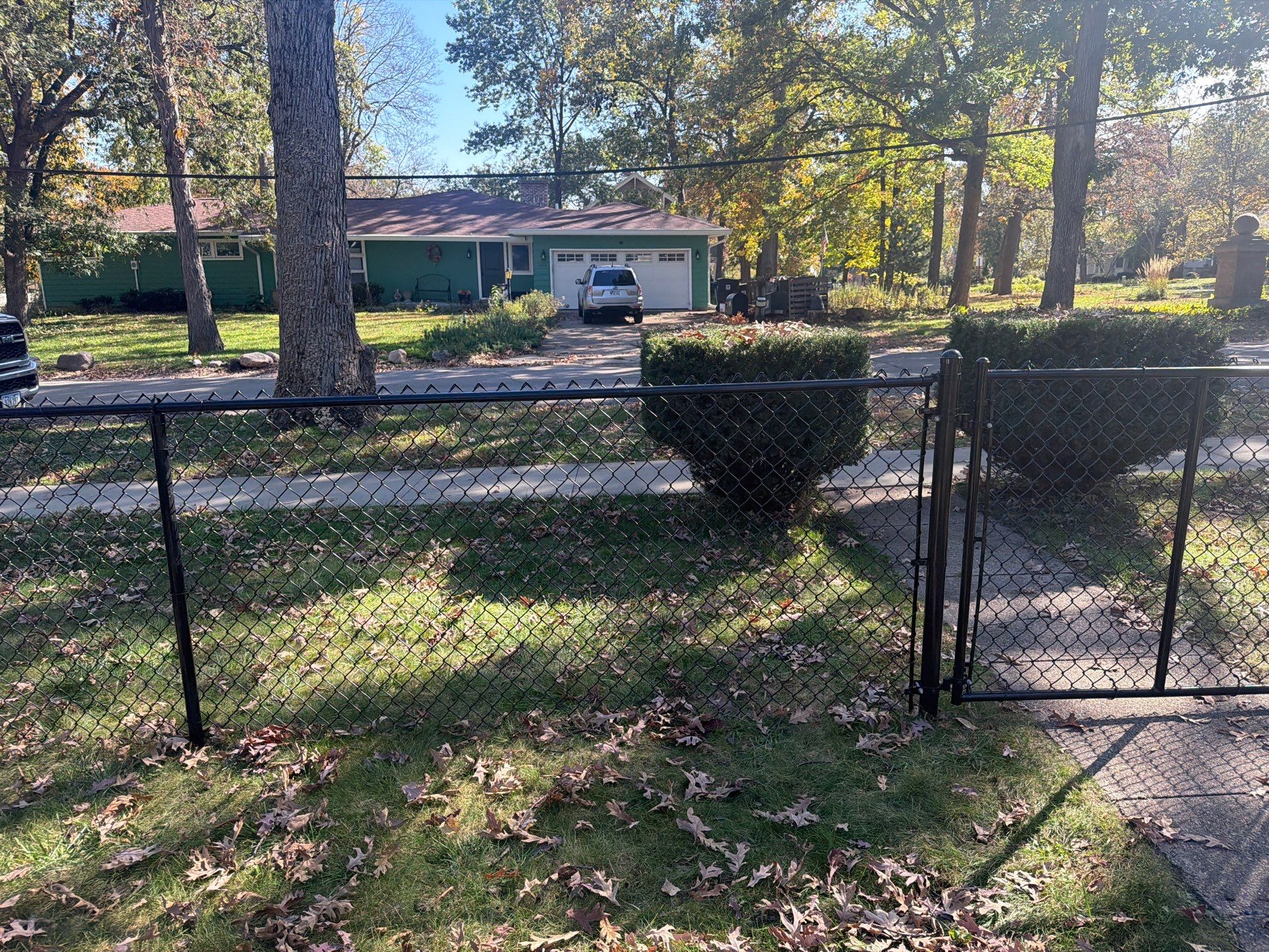 Residential Black Chain Link Fencing in Cedar Falls by Perfect Picket Fence and Stain