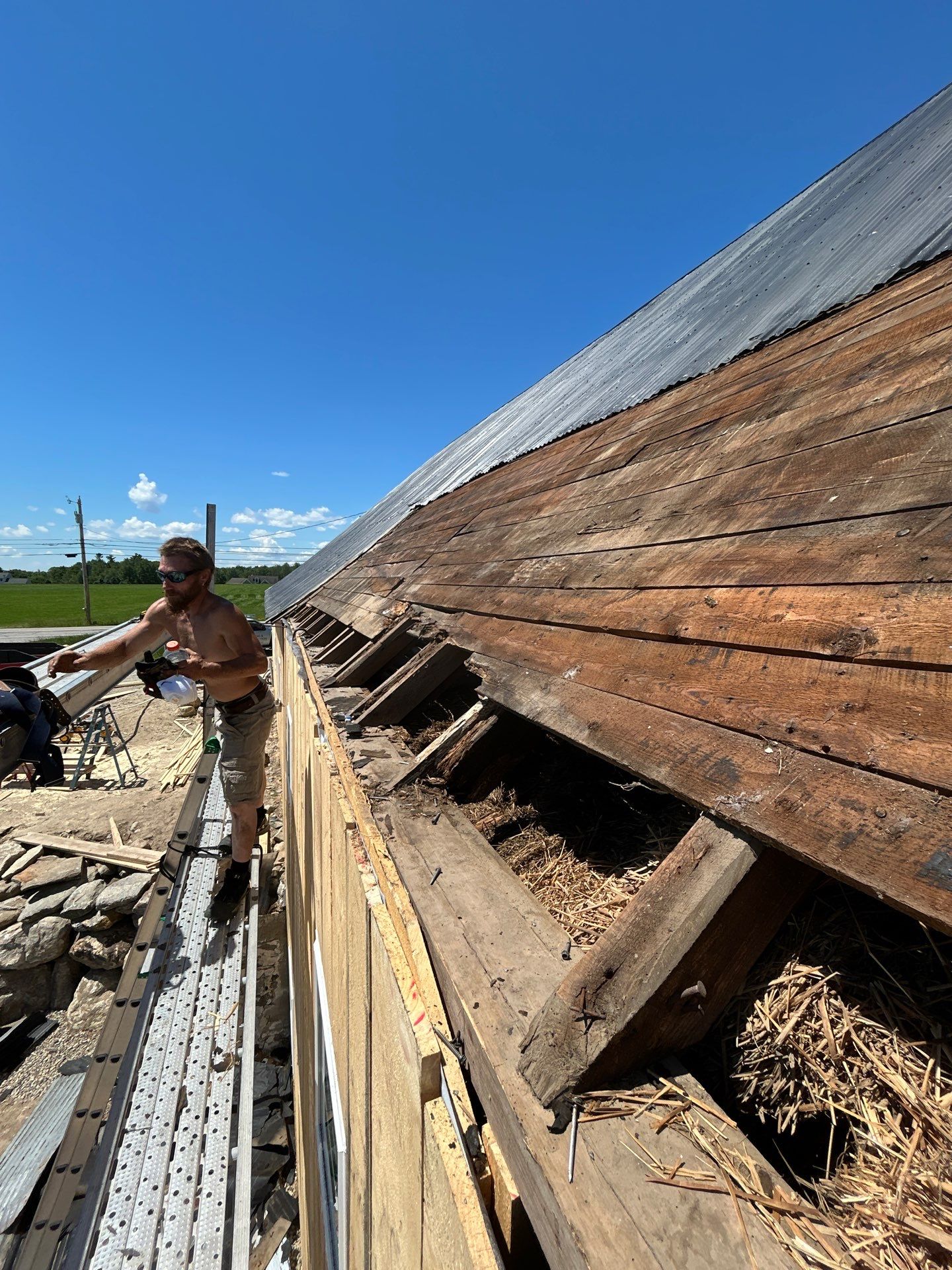 Barn Restoration and Board-and-Batten Siding Installation in Hansons Ridge by B's Roofing & Construction LLC