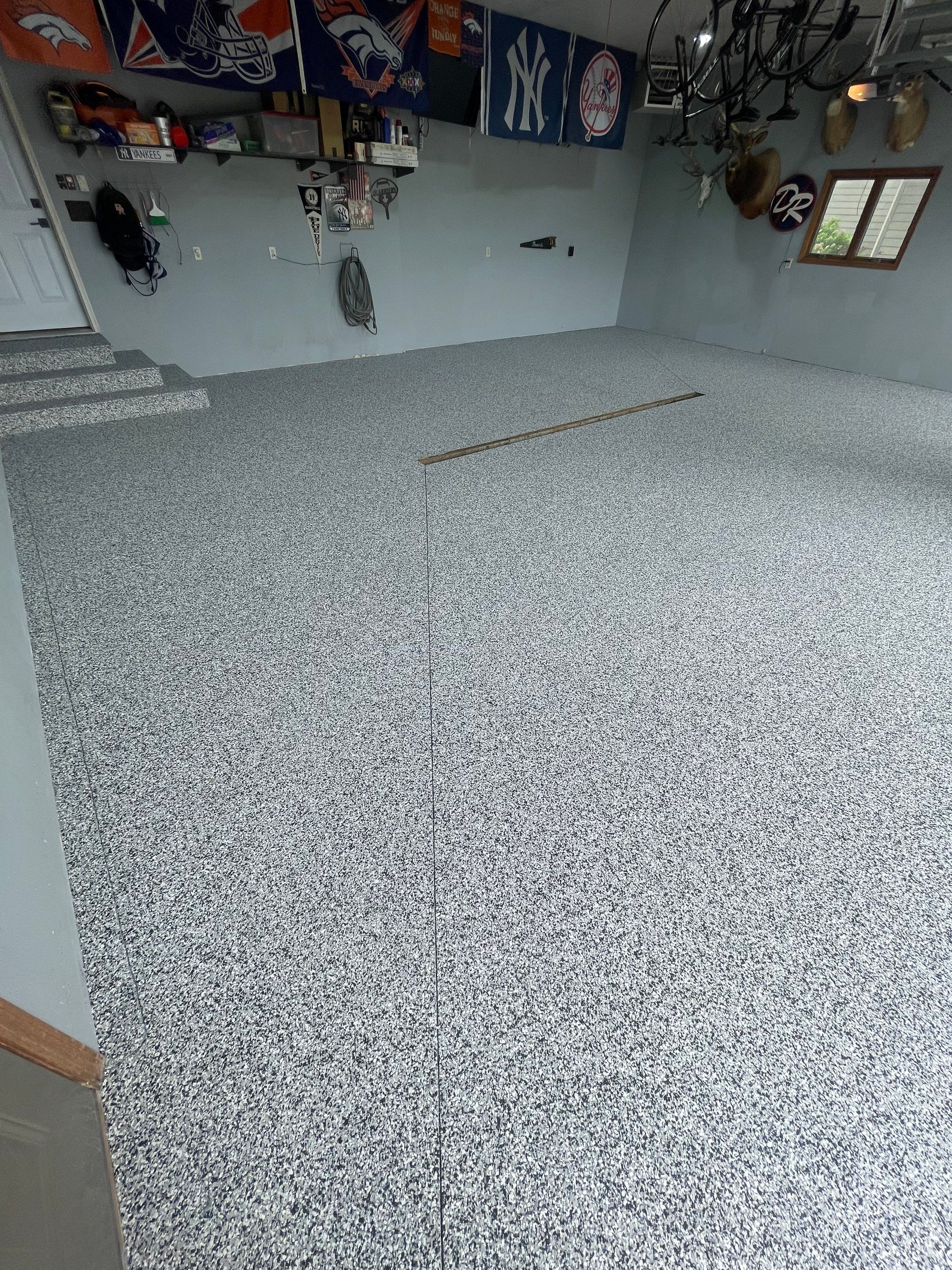 Full Garage Floor Epoxy Coating Installation in Dell Rapids by Select Painting, Coatings & Garage Cabinets
