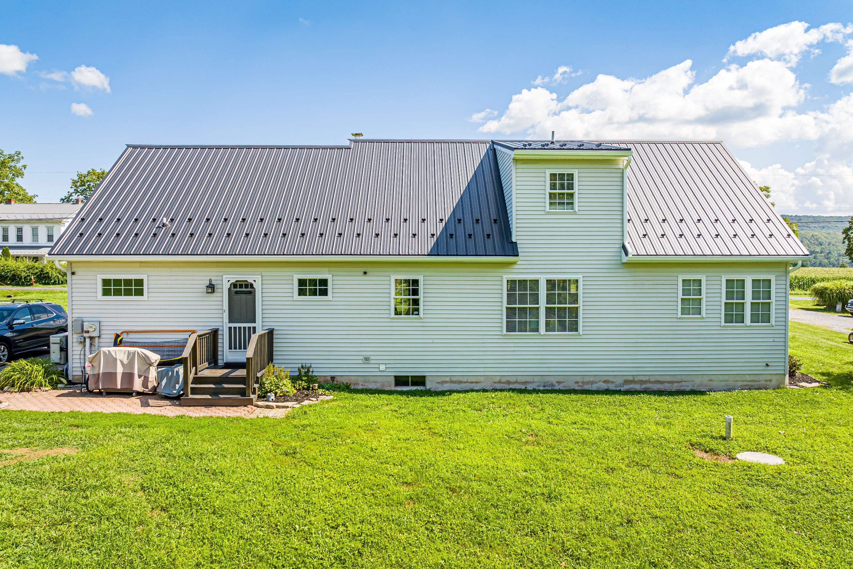 Metal roof install - black by Esh Builders
