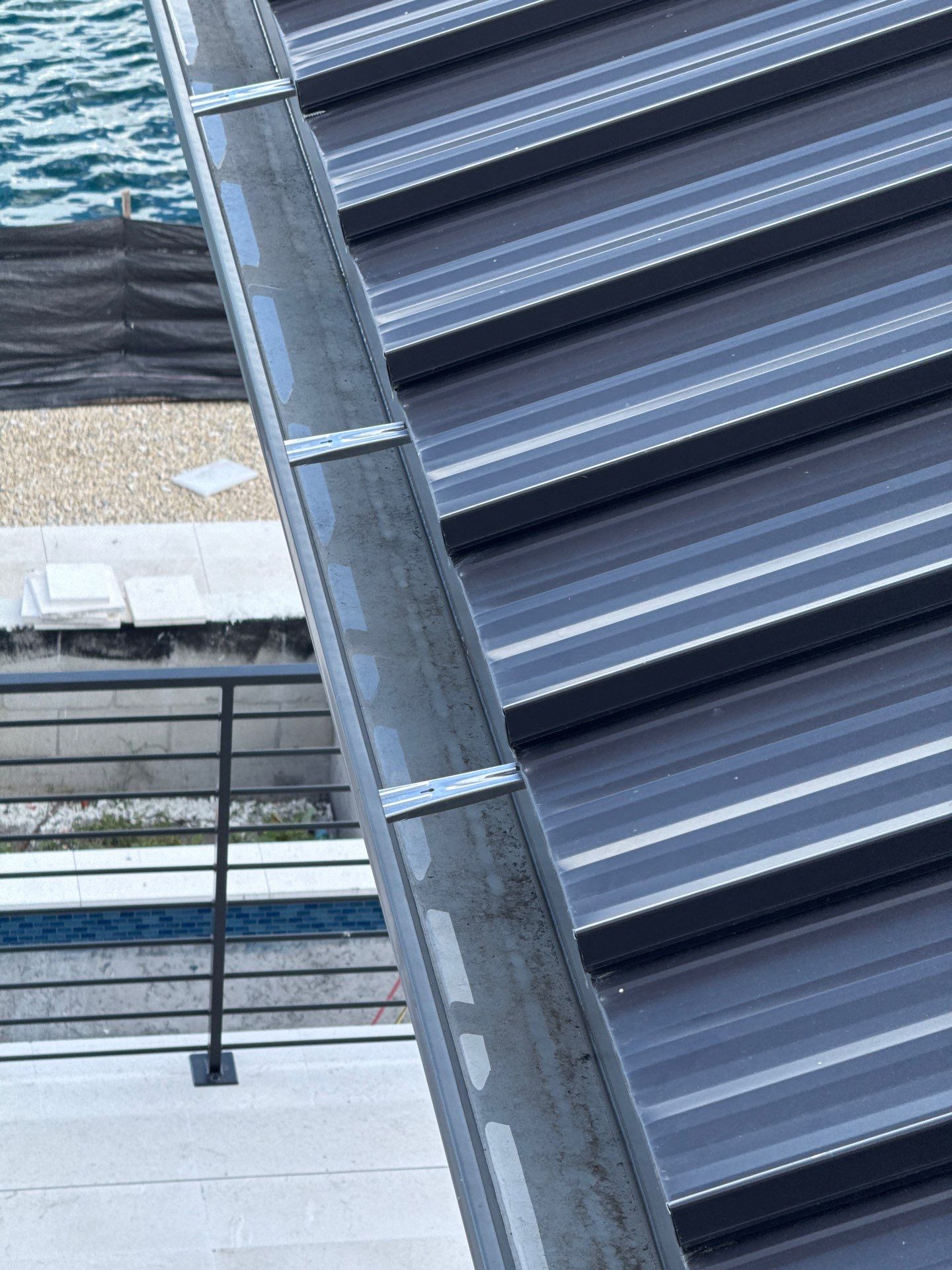 Seamless Aluminum Gutter Installation using black seamless gutters in Sarasota FL by Gutter Professors