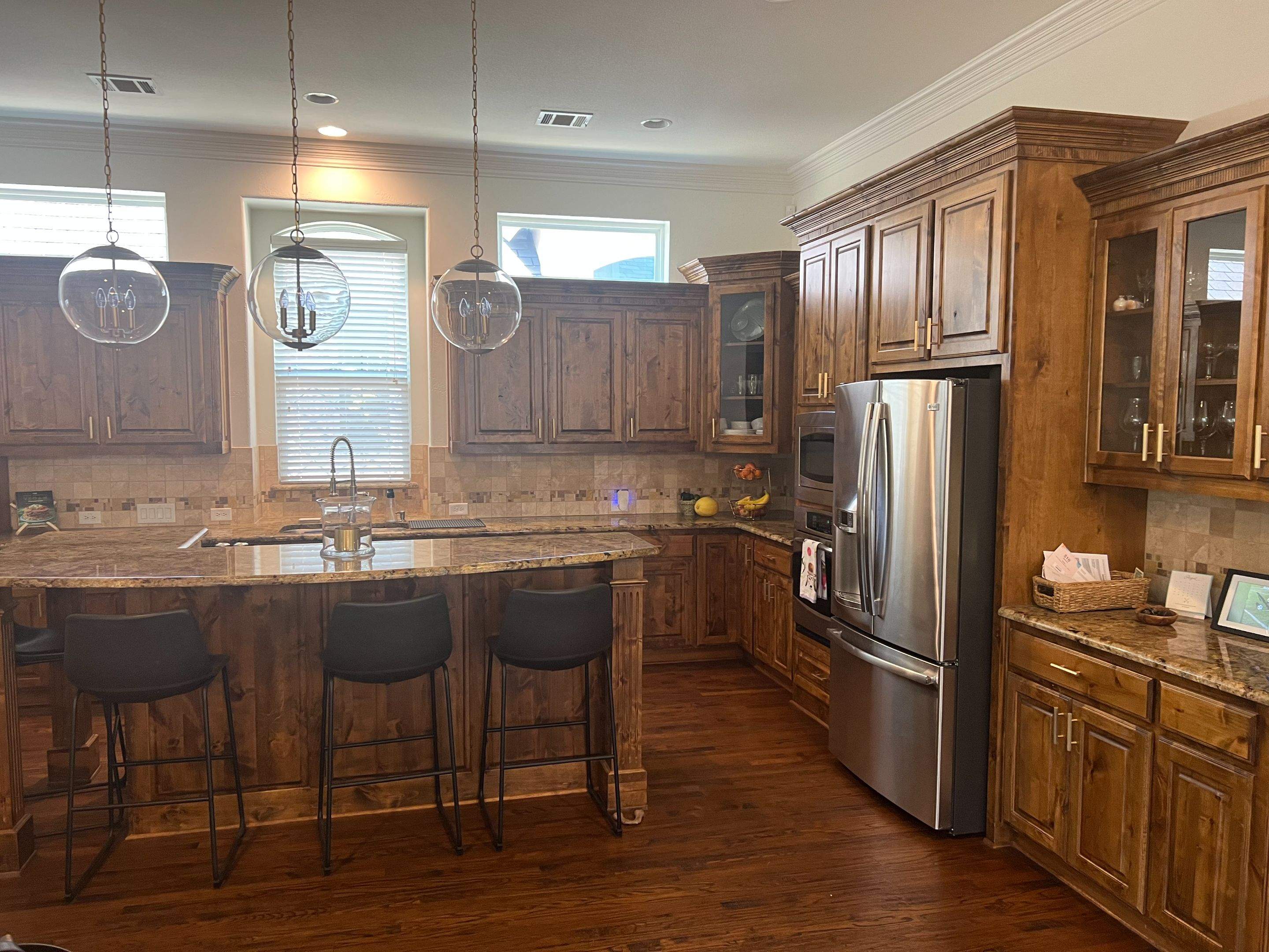 Kitchen Remodel using Quartzite by SLM General Contractors & Roofing