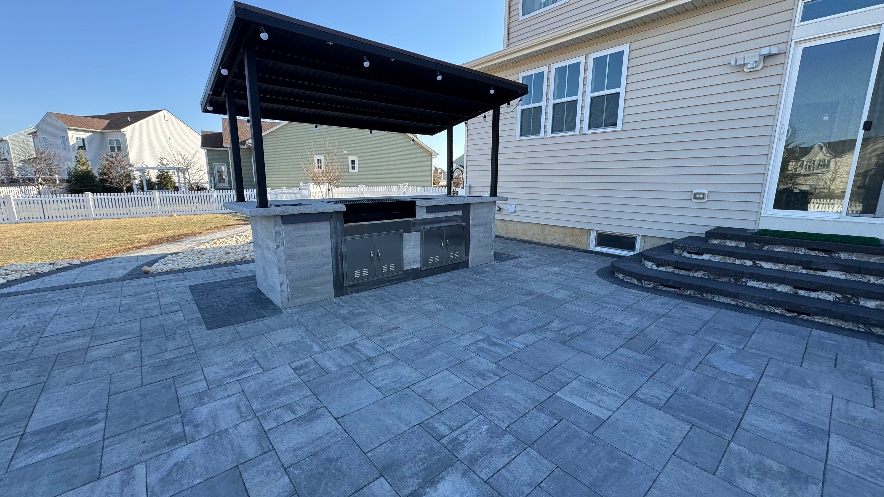 Custom Belgard patio by Studio G Indoor Spaces & Outdoor Living