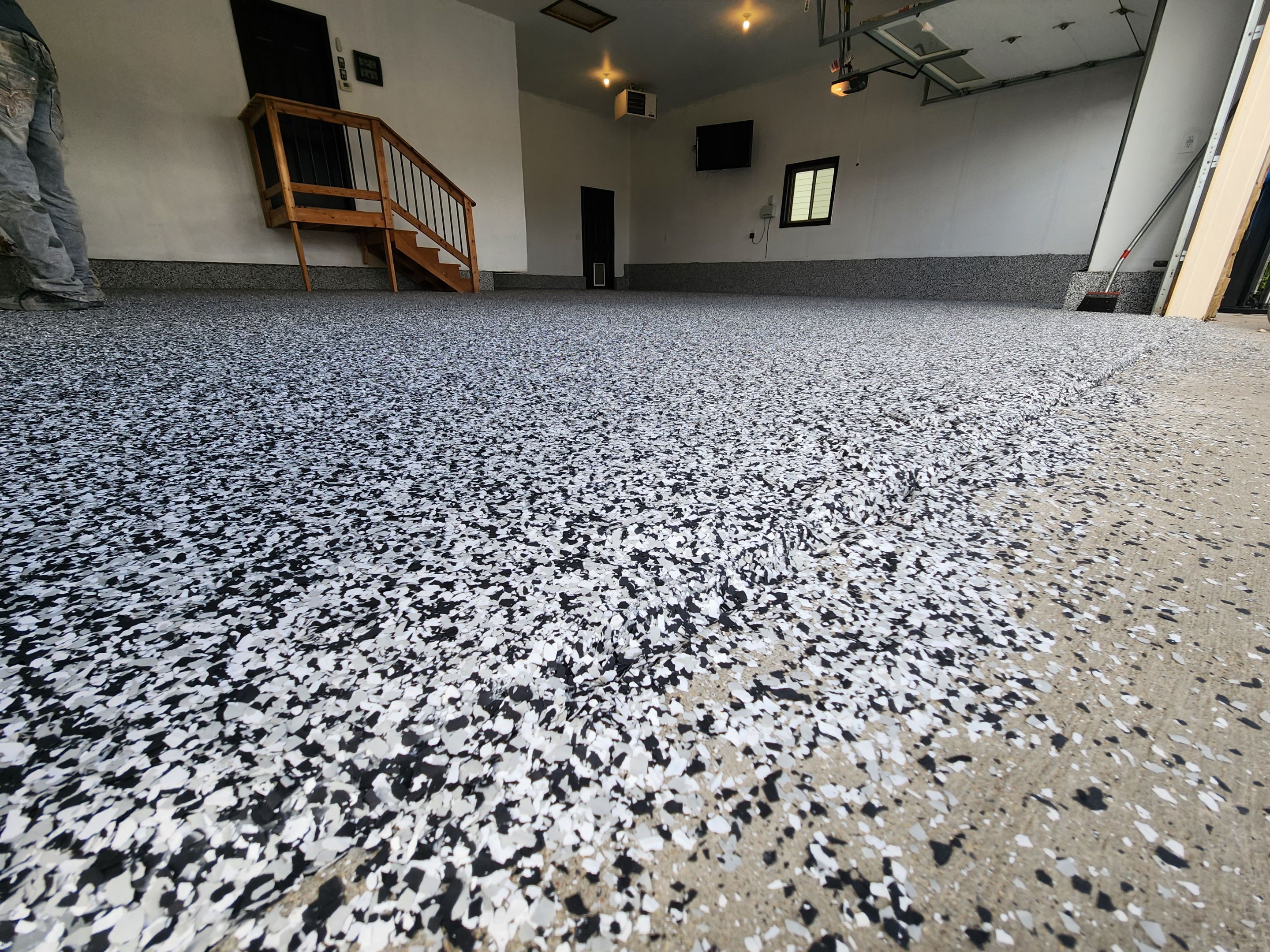 Domino Flake Garage Floor Epoxy Coating in Brandon by Select Painting, Coatings & Garage Cabinets