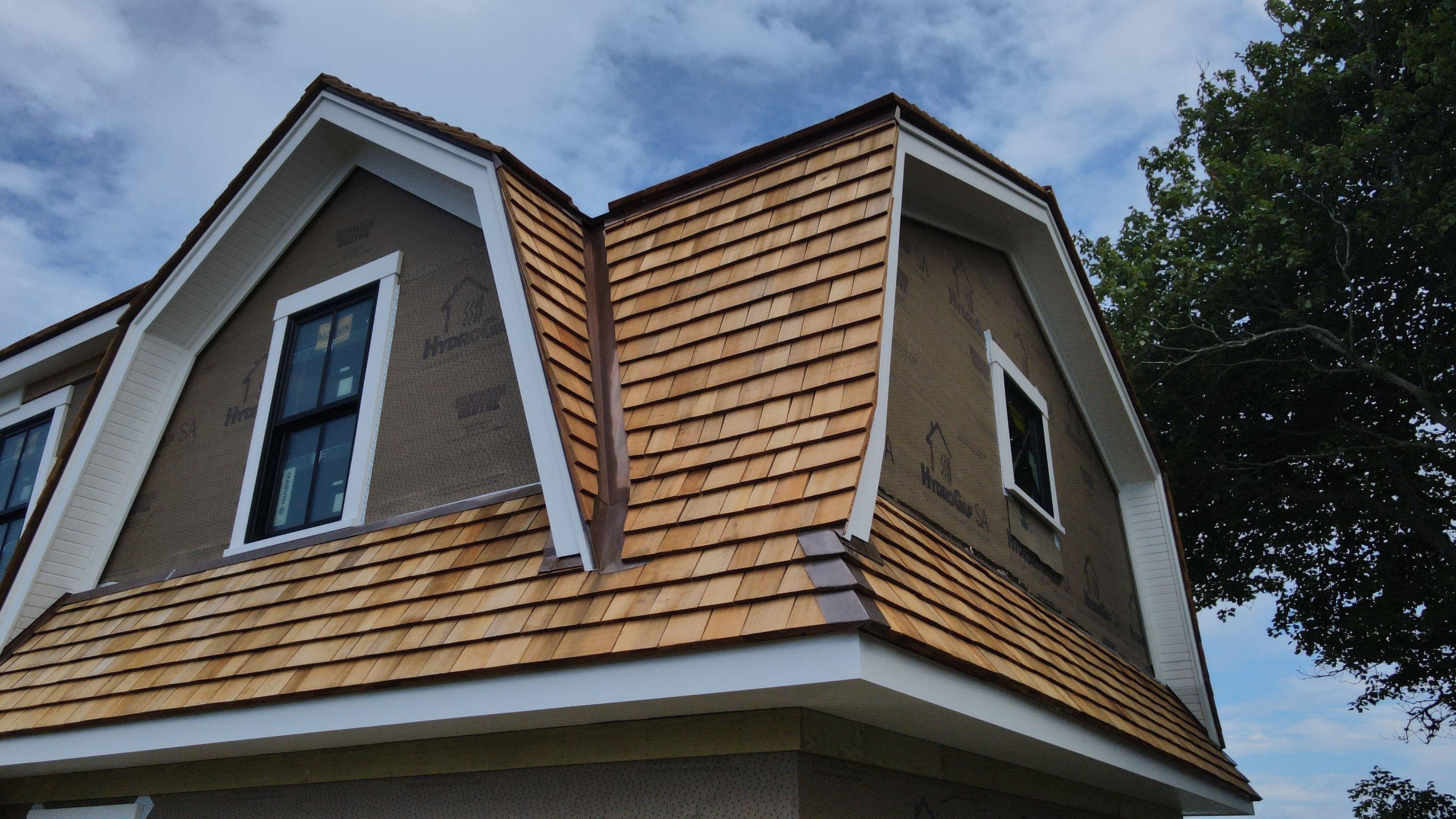 Great Island - Red Cedar Roofing, Yellow Cedar Siding, Standing Seam Copper, & Copper Gutters  by Rinaldi Brothers